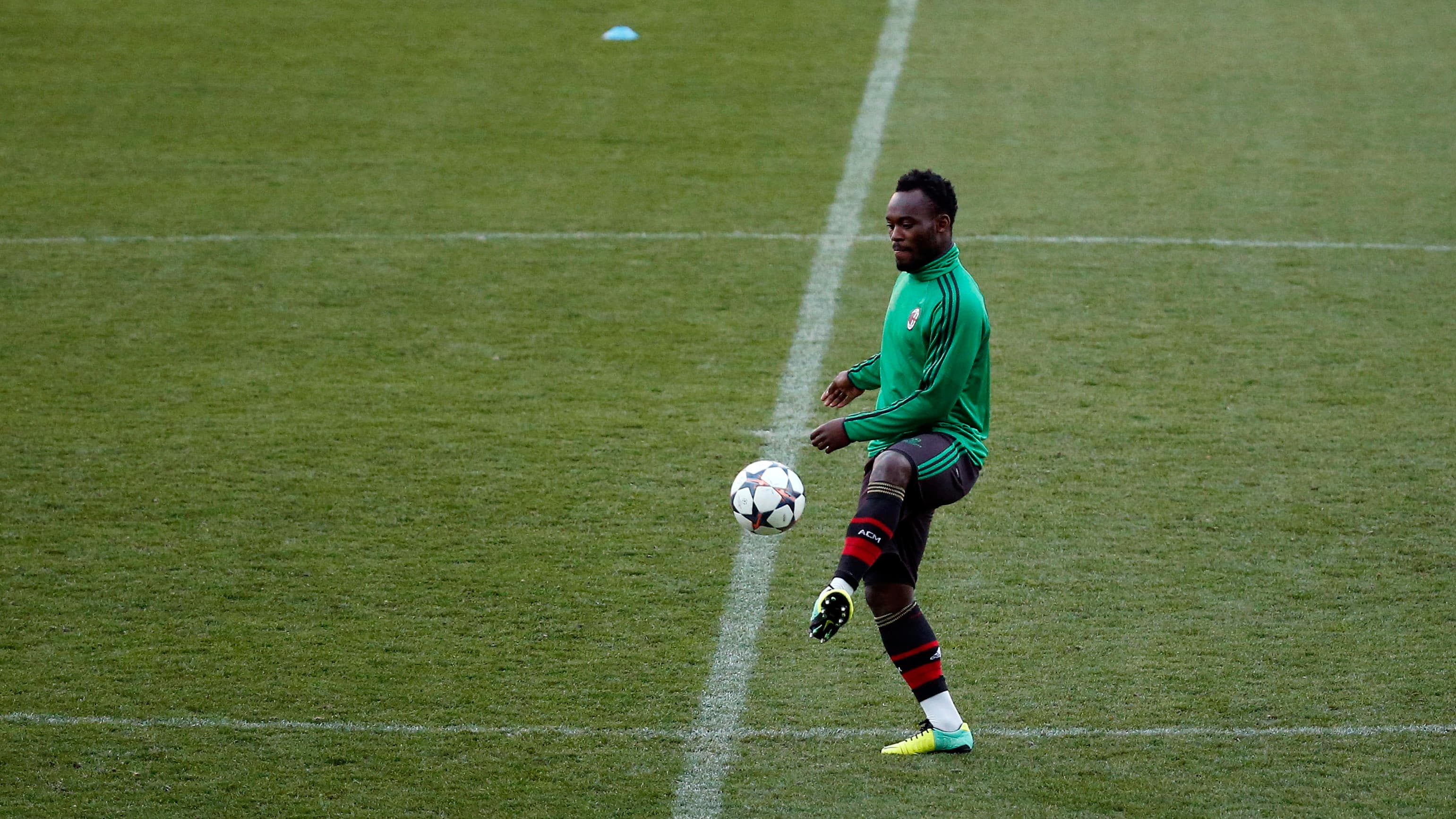 AC Milan's Michael Essien takes part in a training session at the Vicente Calderon stadium in Madrid on March 10, 2014, ahead of a UEFA Champions League match against Atlético Madrid.