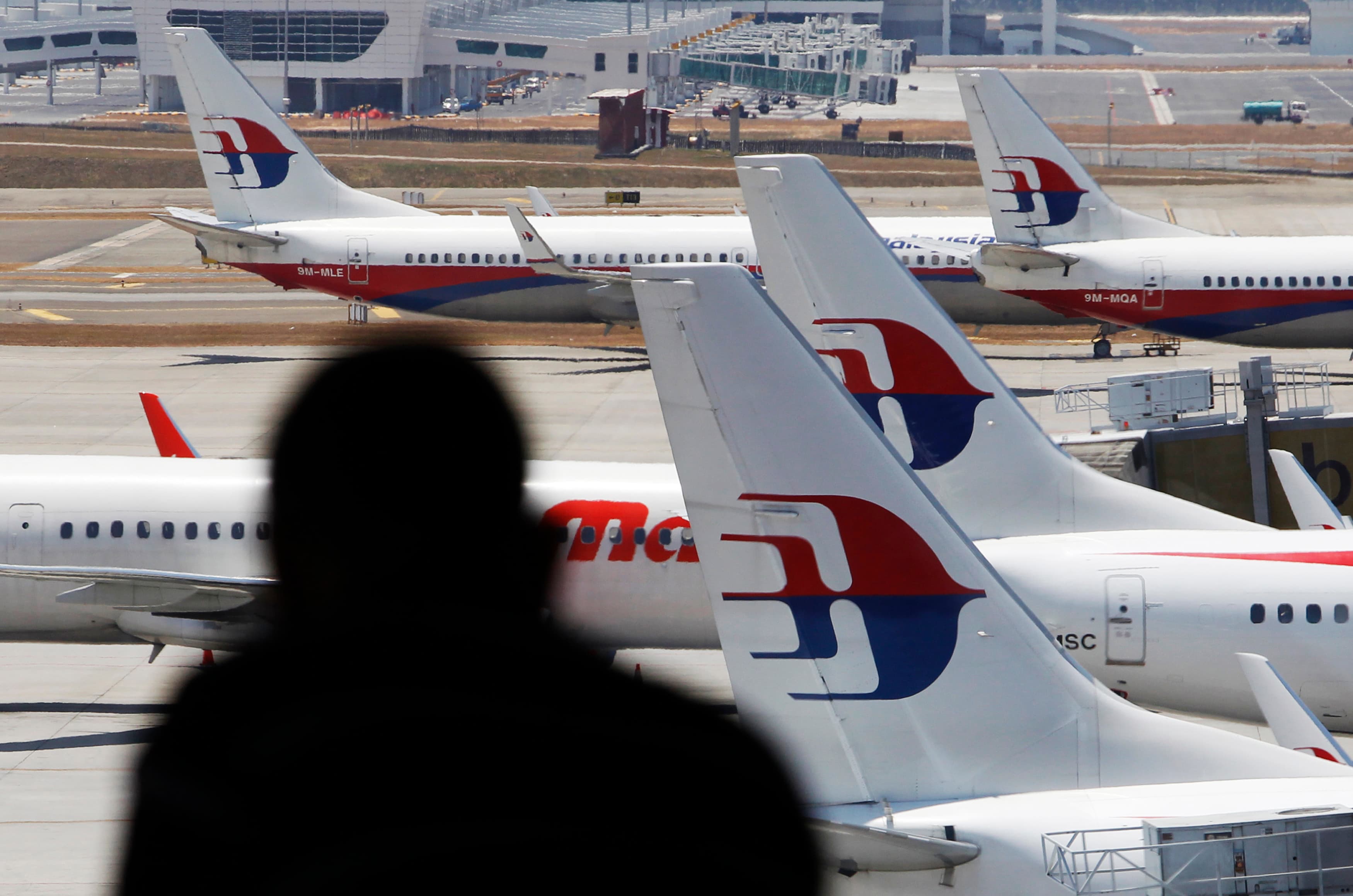 Malaysia Airlines planes sit on the tarmac at the Kuala Lumpur International Airport on March 11, 2014.