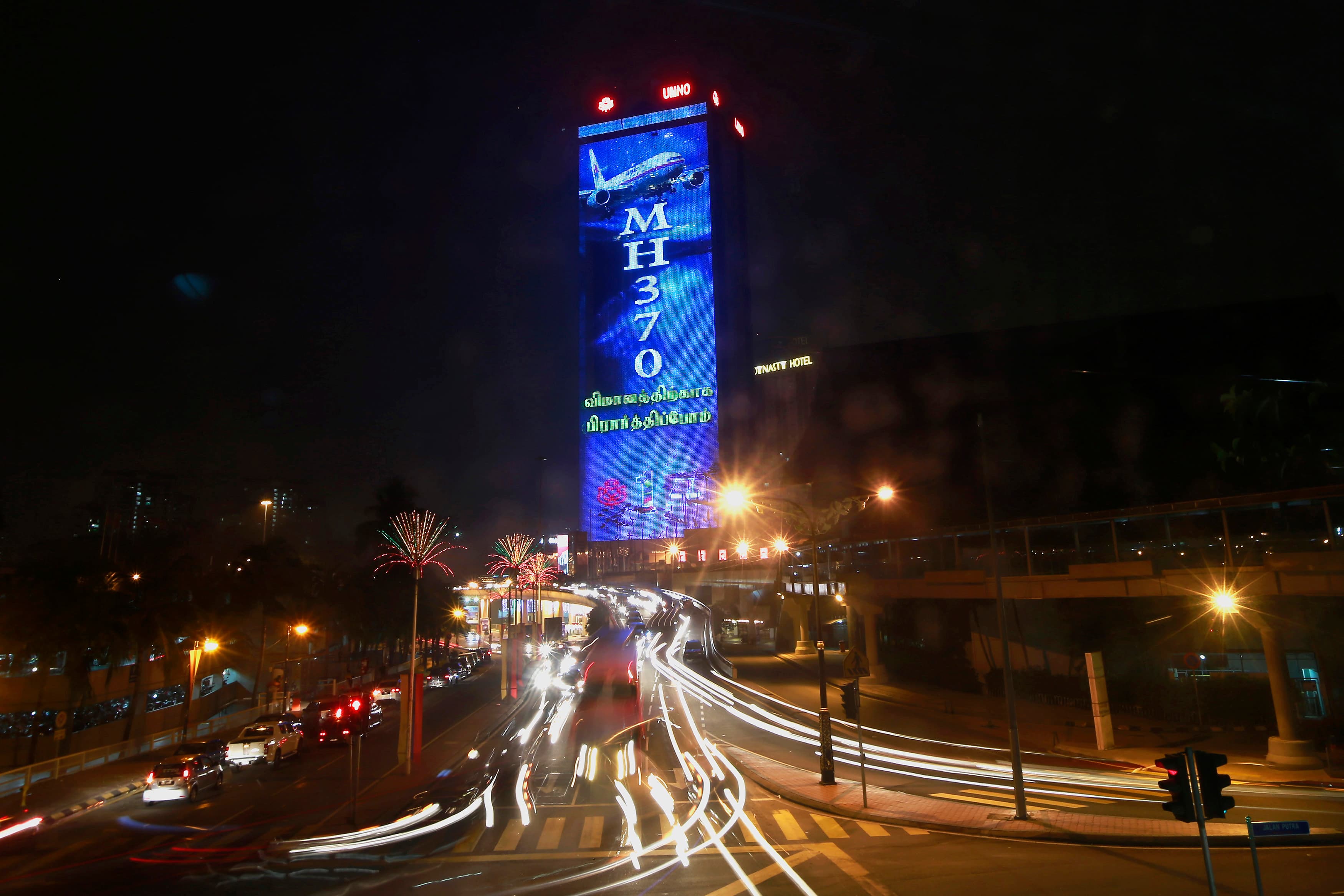 A "Pray for MH370" projection is seen on the Putra World Trade Centre building in Kuala Lumpur.