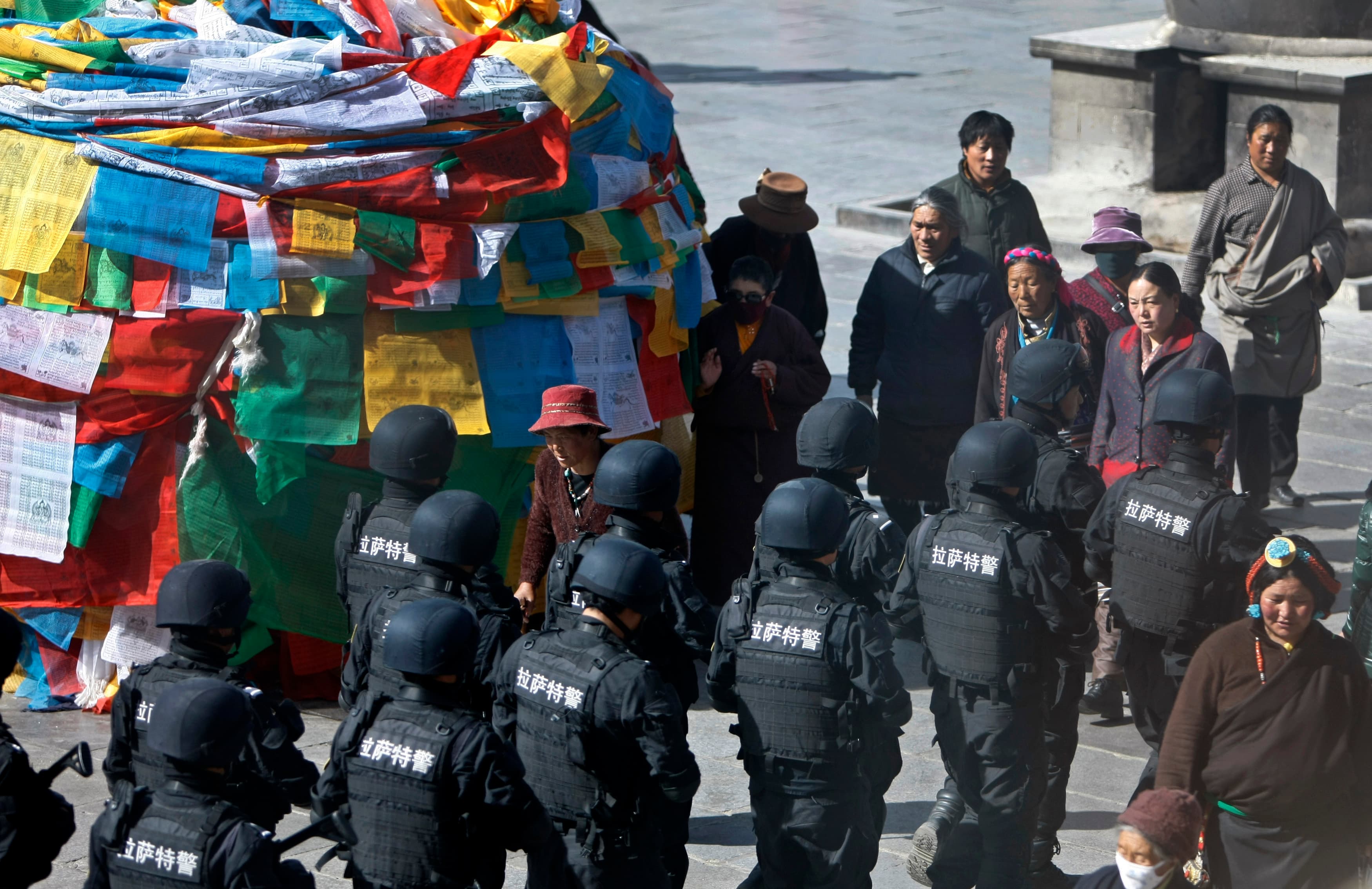 Chinese police patrolled outside Johkhang Monastery in the capital of the Tibet Autonomous Region of China in March 2014. Security forces always go on high alert around the sensitive March 10th anniversary.