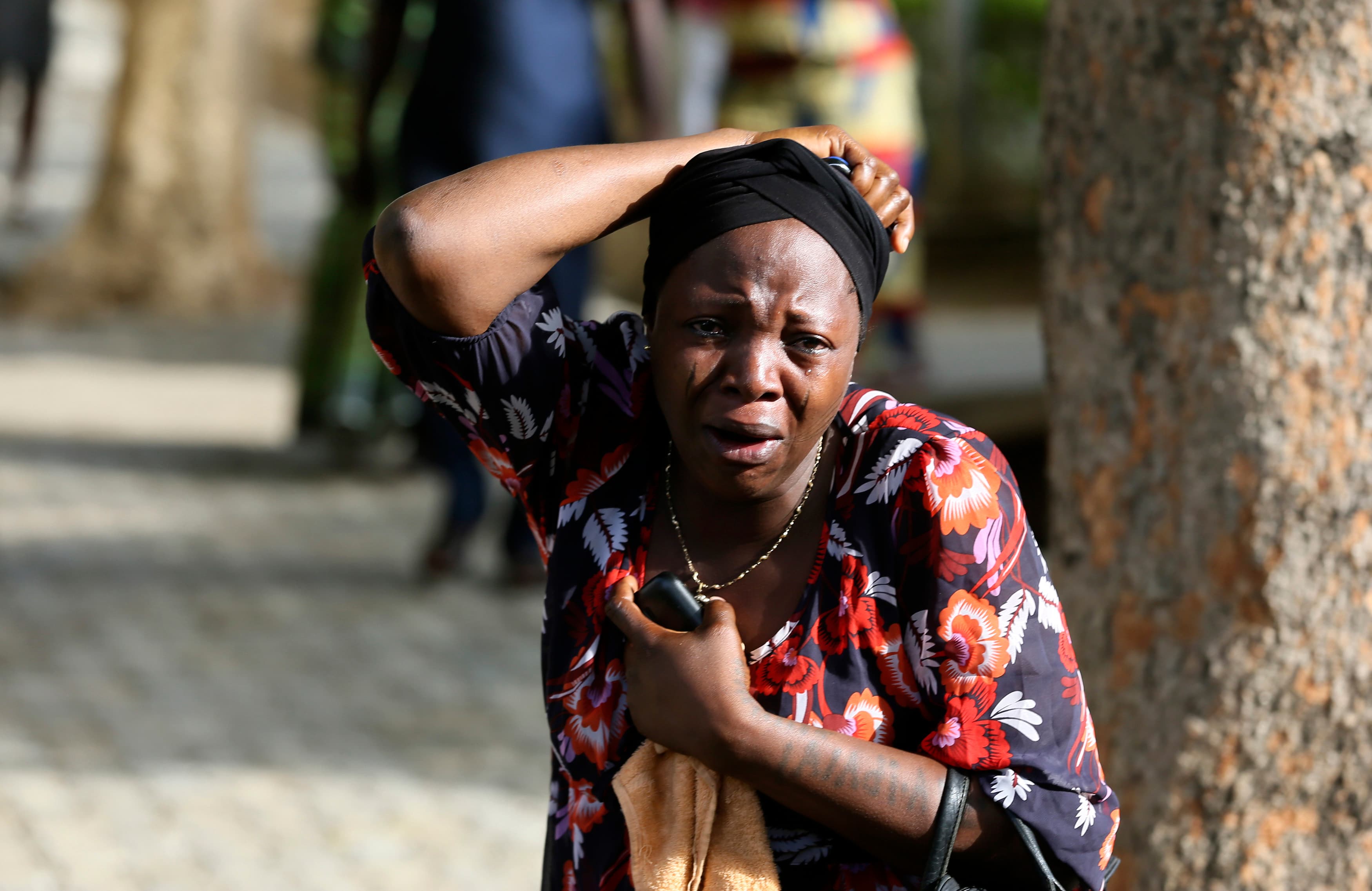 Abuja residents react as victims of a bomb blast arrive at a local hospital this week.
