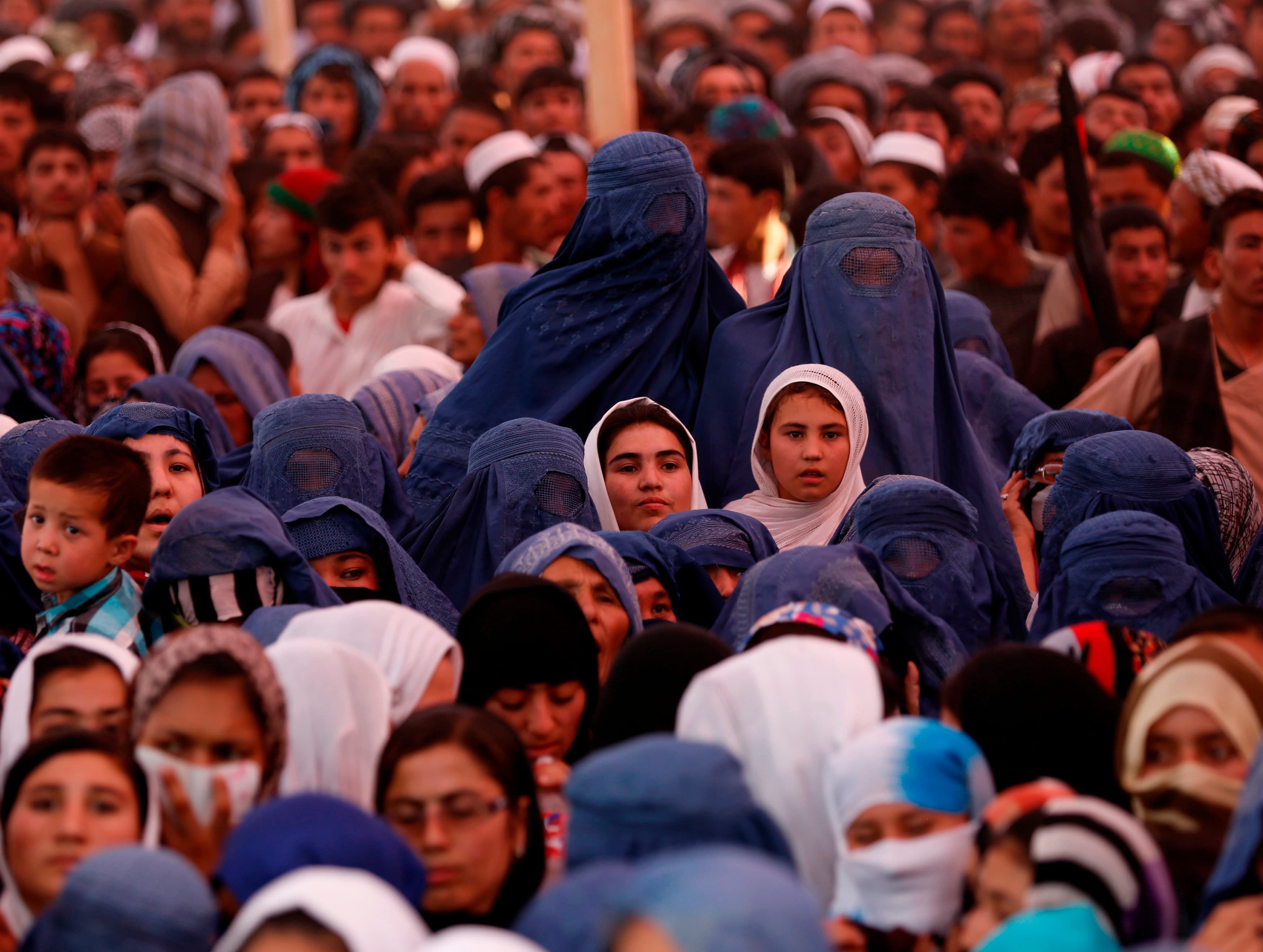 Women attend an election campaign by Afghan presidential candidate Ashraf Ghani Ahmadzai in Jozjan province on June 2, 2014. The second round of Afghanistan's presidential election will take place on June 14.
