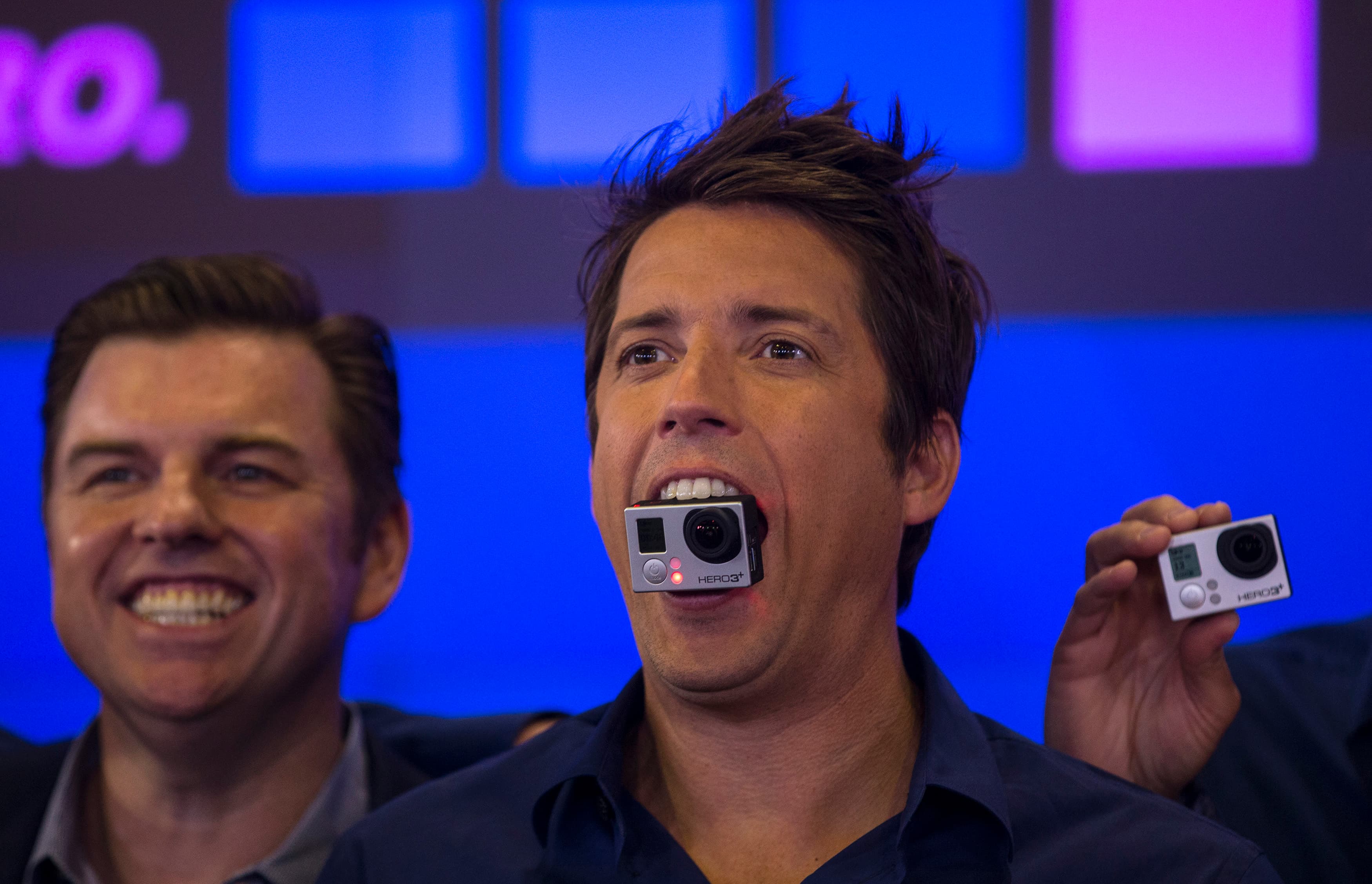 GoPro founder and CEO Nick Woodman holds a GoPro camera in his mouth as he celebrates the company's IPO at the Nasdaq Market Site in New York on June 26, 2014.