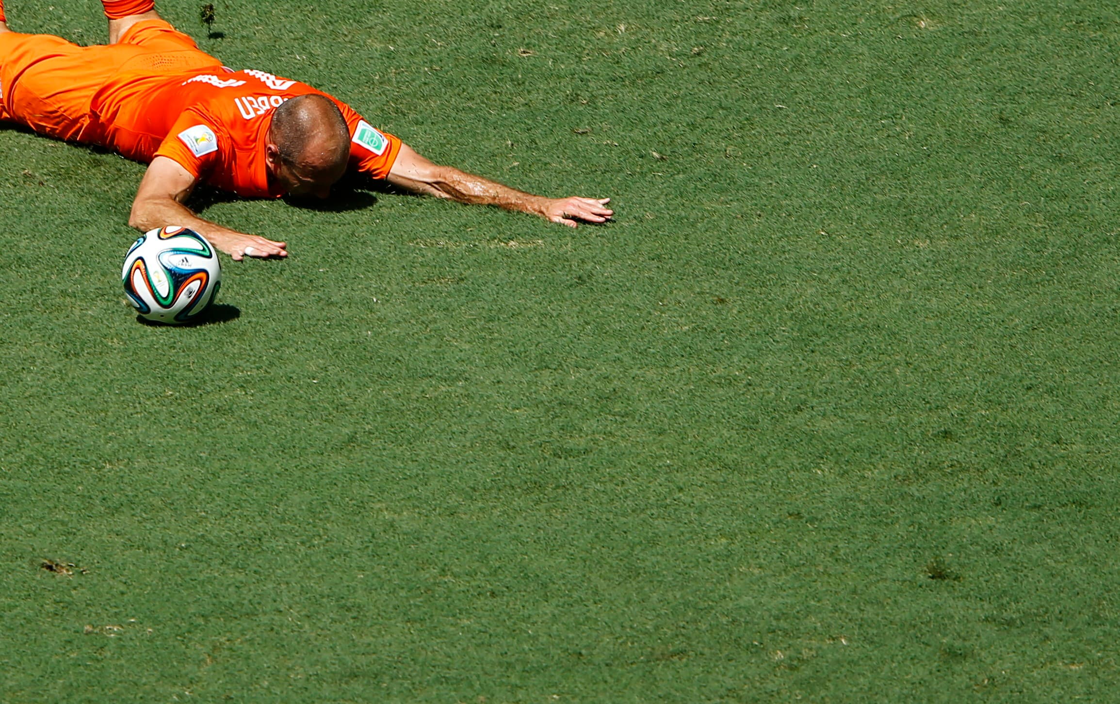 Arjen Robben of the Netherlands falls on the pitch during the 2014 World Cup round of 16 game between Mexico and the Netherlands at the Castelao arena in Fortaleza June 29, 2014. No foul was called.