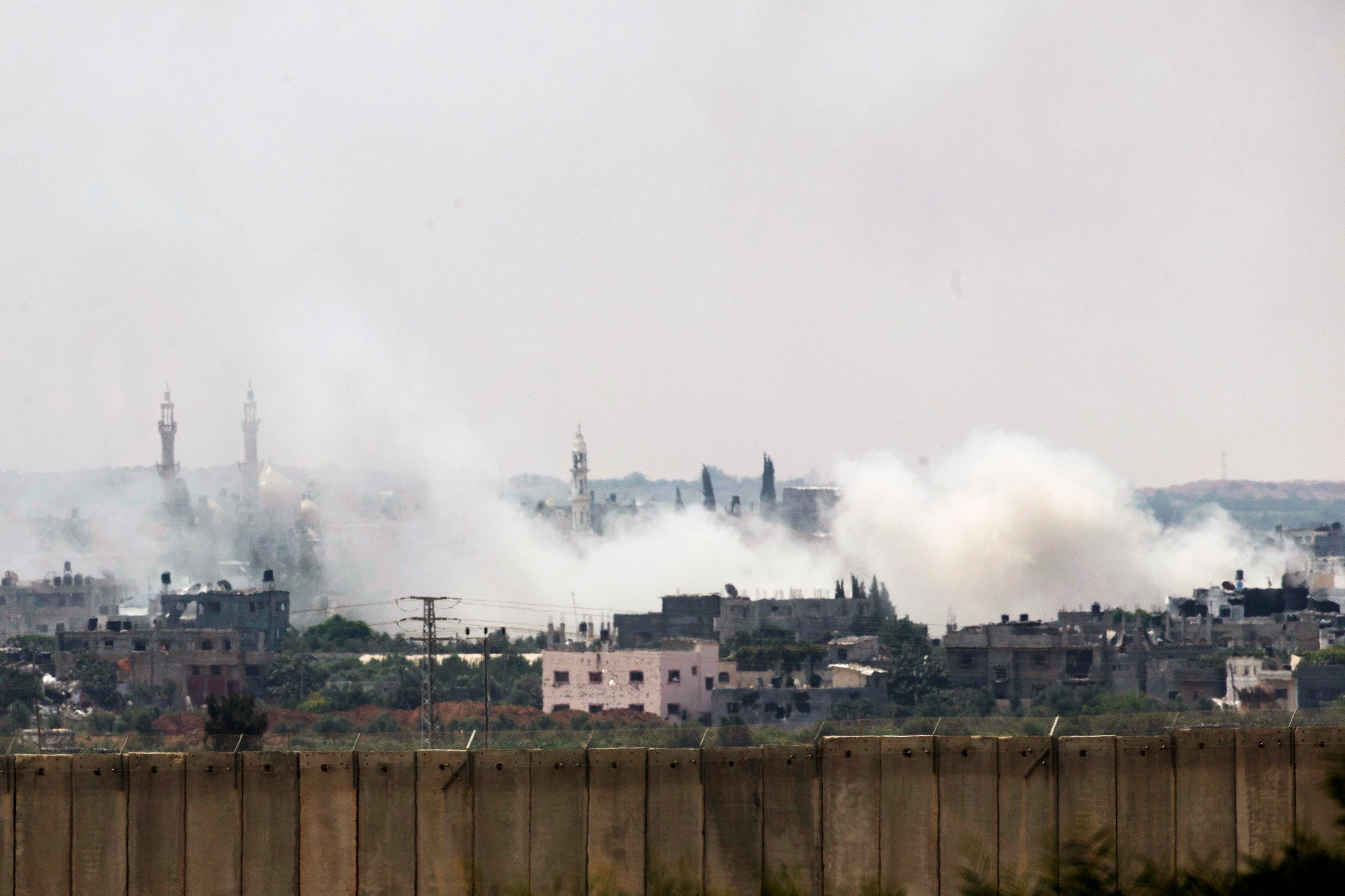 Smoke rises after an Israeli strike over the northern Gaza Strip Tuesday. Military and civilian casualties are mounting as Israeli forces push into urban areas like this.