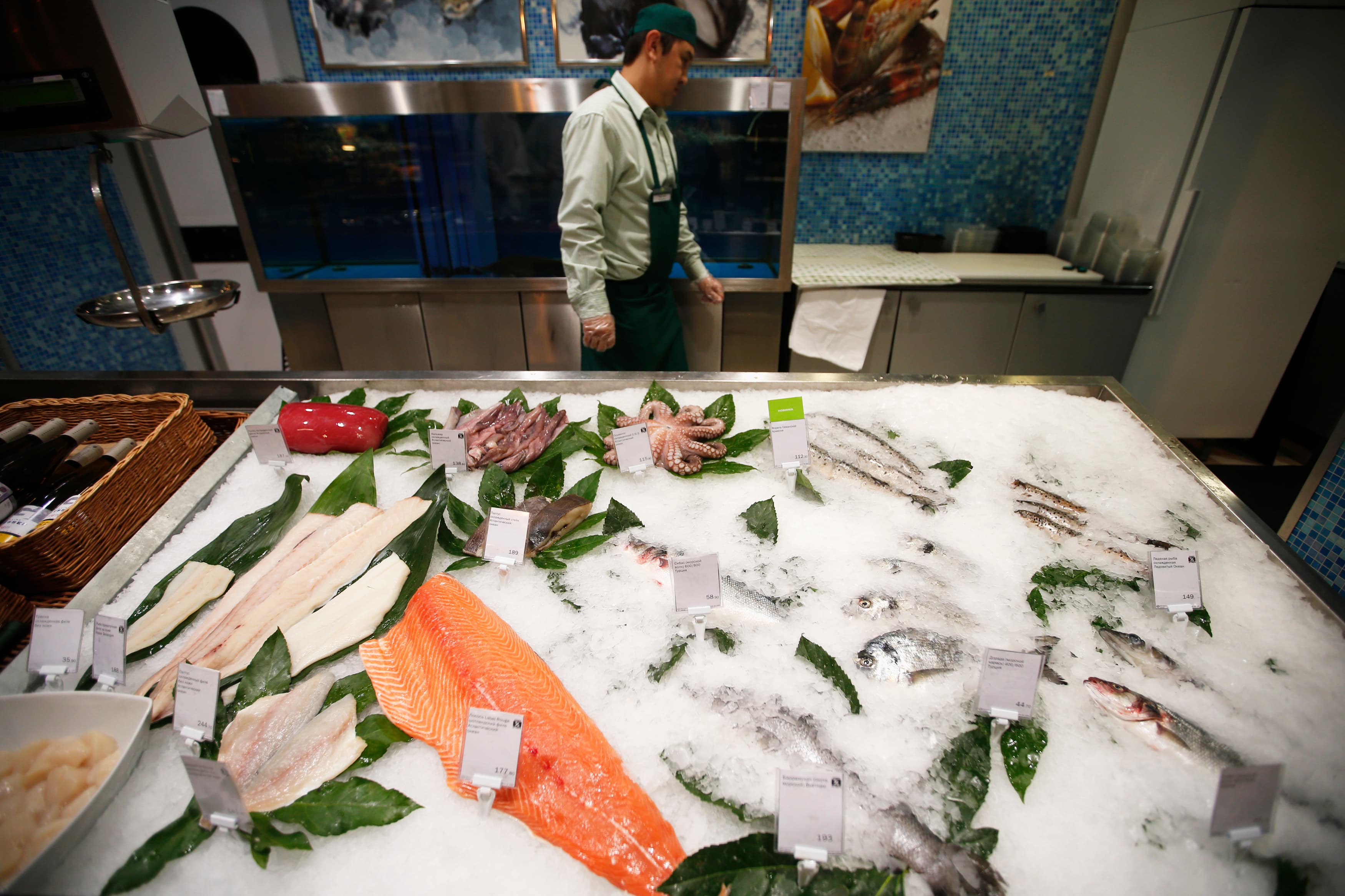 Fish and seafood are displayed for sale at a grocery store in Moscow. Embargoes mean that Russia's usual sources of fish have been replaced by food from other areas, and Russians aren't happy with the new options.