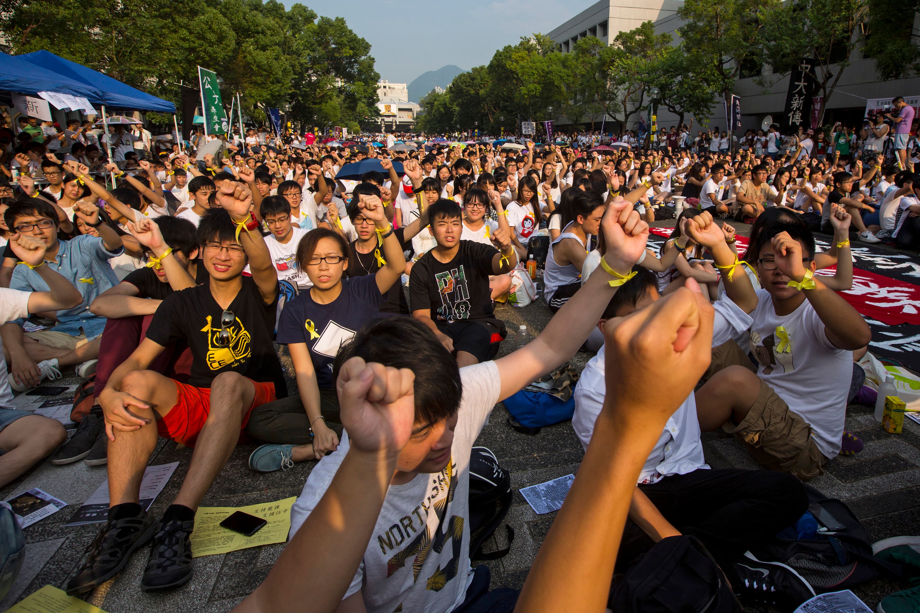 Students and teachers shout during a rally at the Chinese University of Hong Kong on Monday, the start of a planned week-long class boycott for more democratic freedoms.