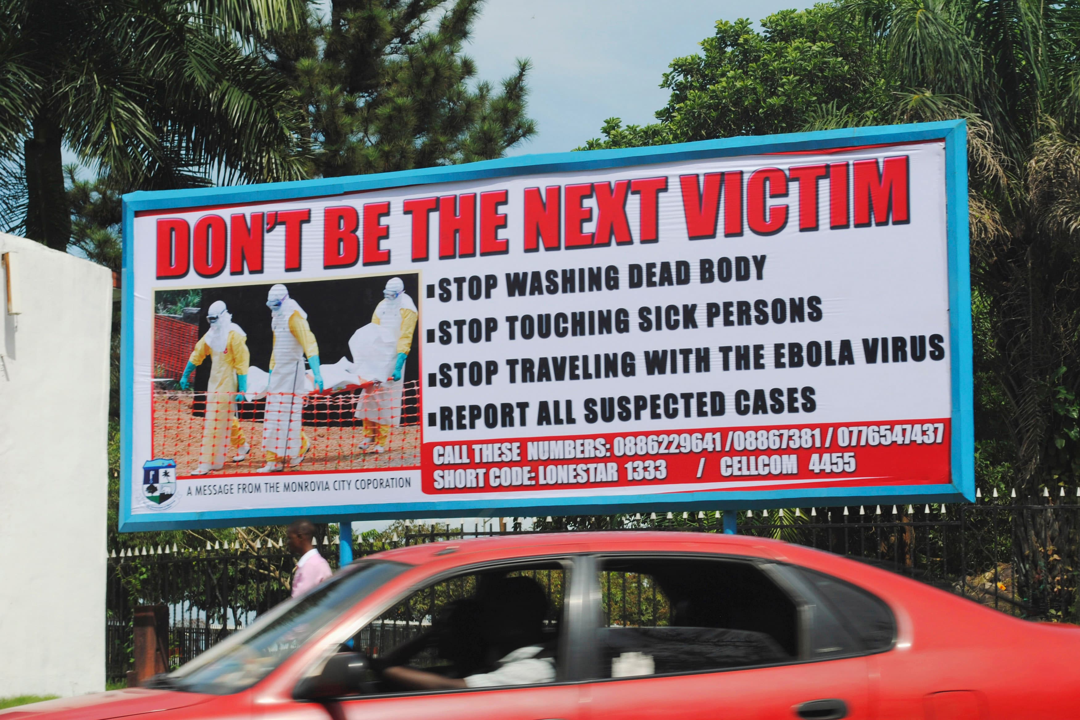 A billboard in Liberia's capital Monrovia offers advice on how to halt the spread of Ebola.