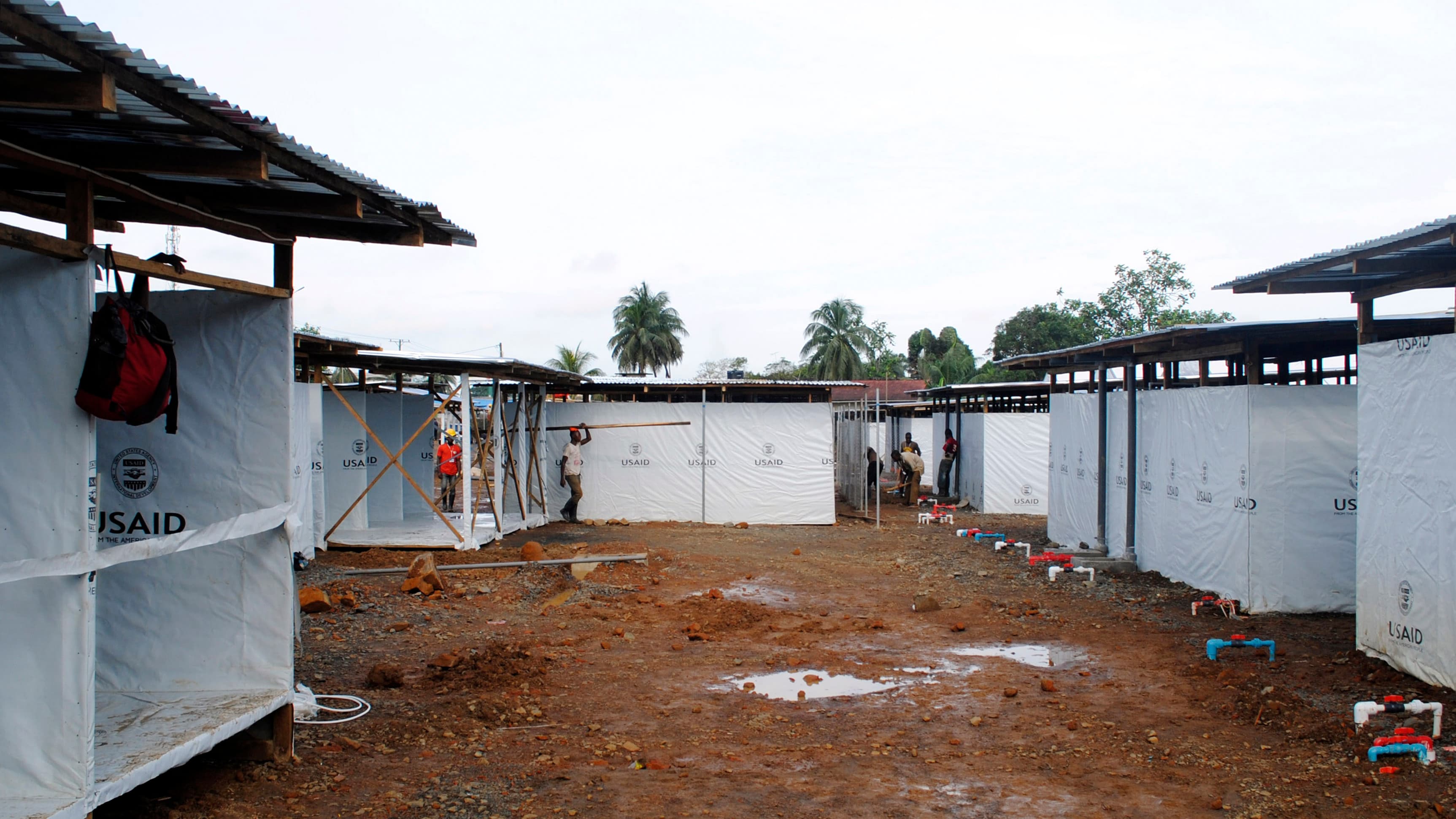 Workers put the finishing touches on an Ebola virus treatment center in Monrovia on October 9, 2014.