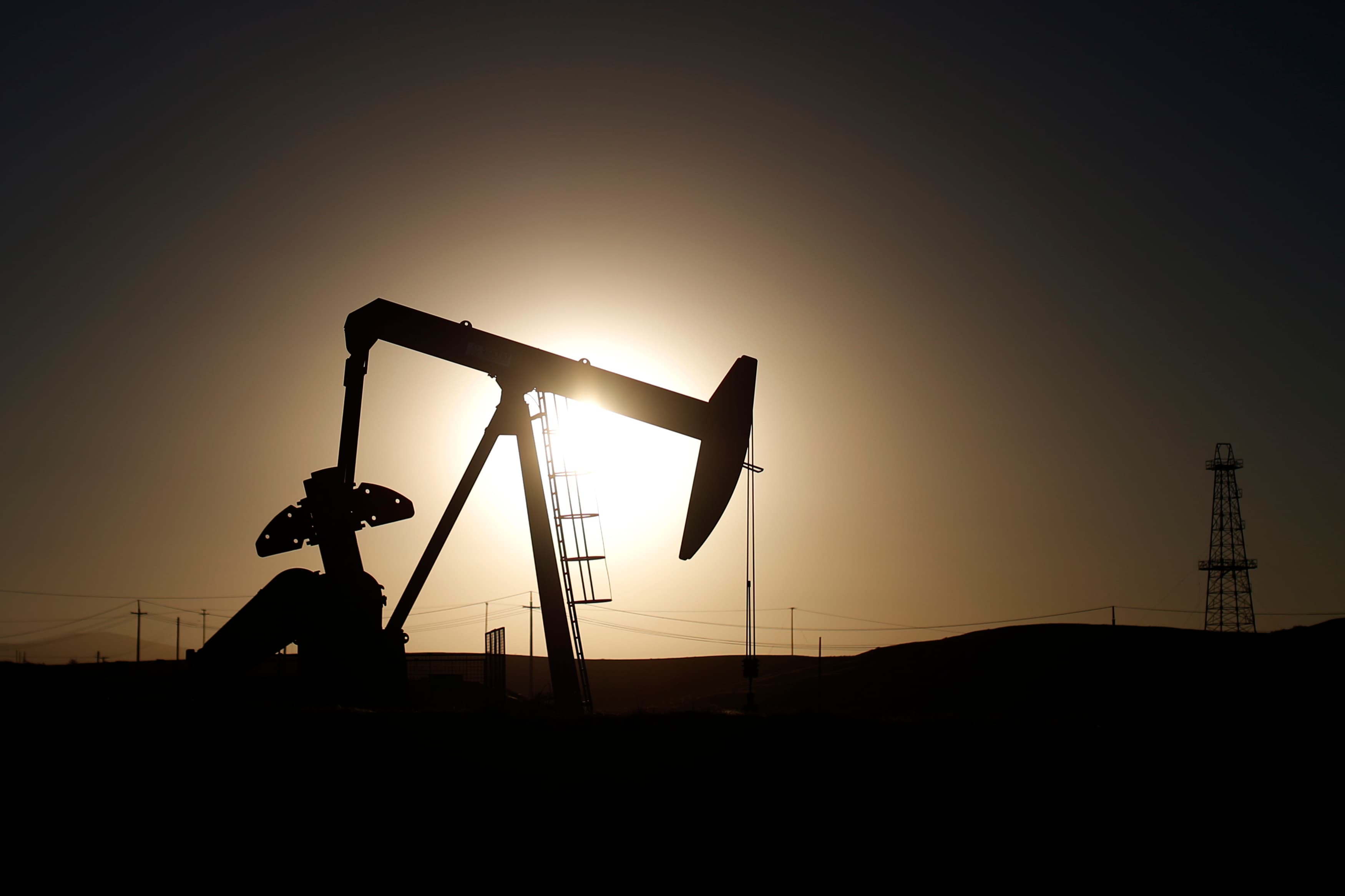 A pump jack is seen at sunrise near Bakersfield, California.