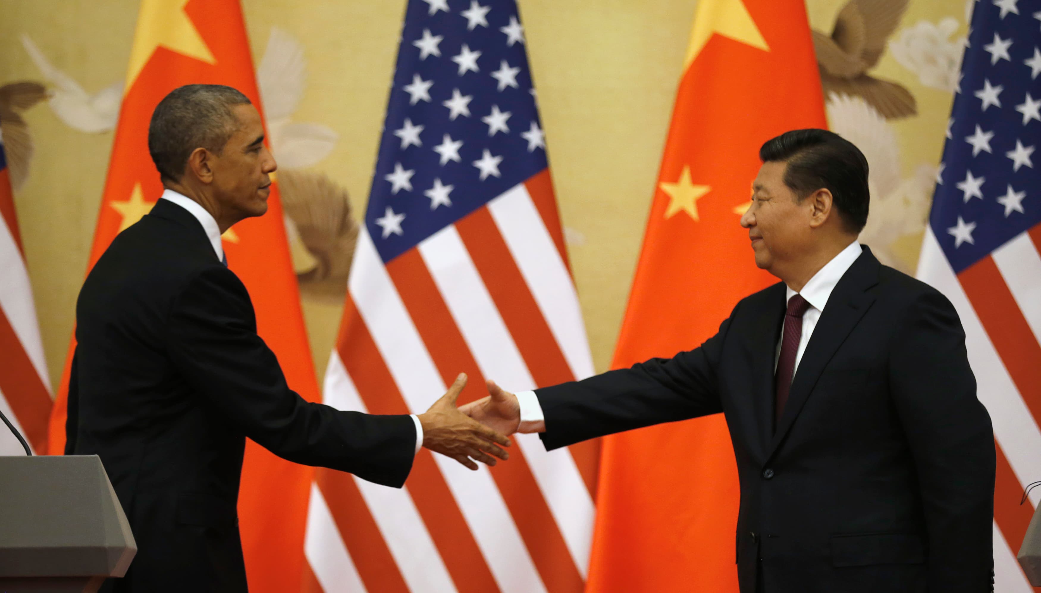 U.S. President Barack Obama and Chinese President Xi Jinping shake hands at the end of their news conference in the Great Hall of the People in Beijing on November 12, 2014.