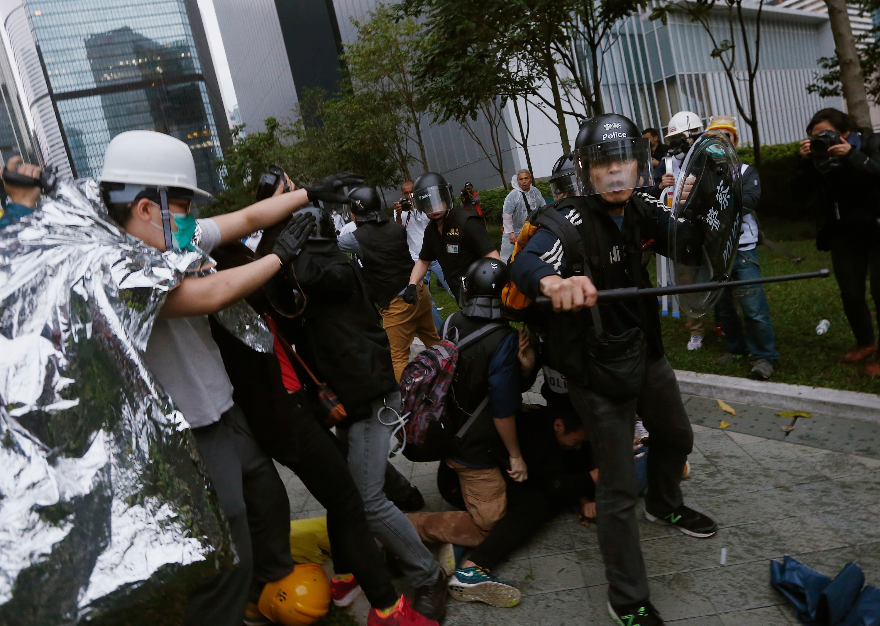 Hong Kong police baton-charged and pepper-sprayed thousands of pro-democracy demonstrators in the early hours of December 1, 2014. The protesters were trying to encircle government headquarters, defying orders to retreat after more than two months of prot