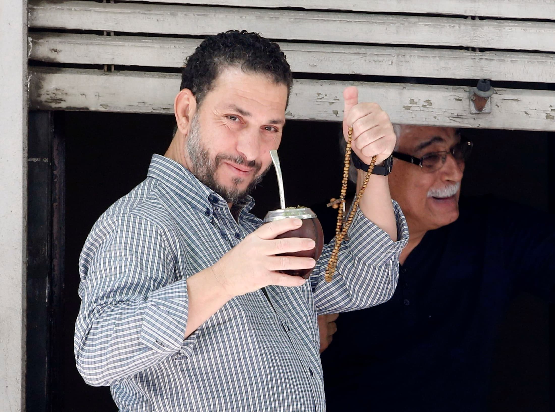 The recent releases from Guantanamo include former detainee Adel bin Muhammad El Ouerghi of Tunisia shown standing on a balcony in Montevideo, Uruguay, his new home.