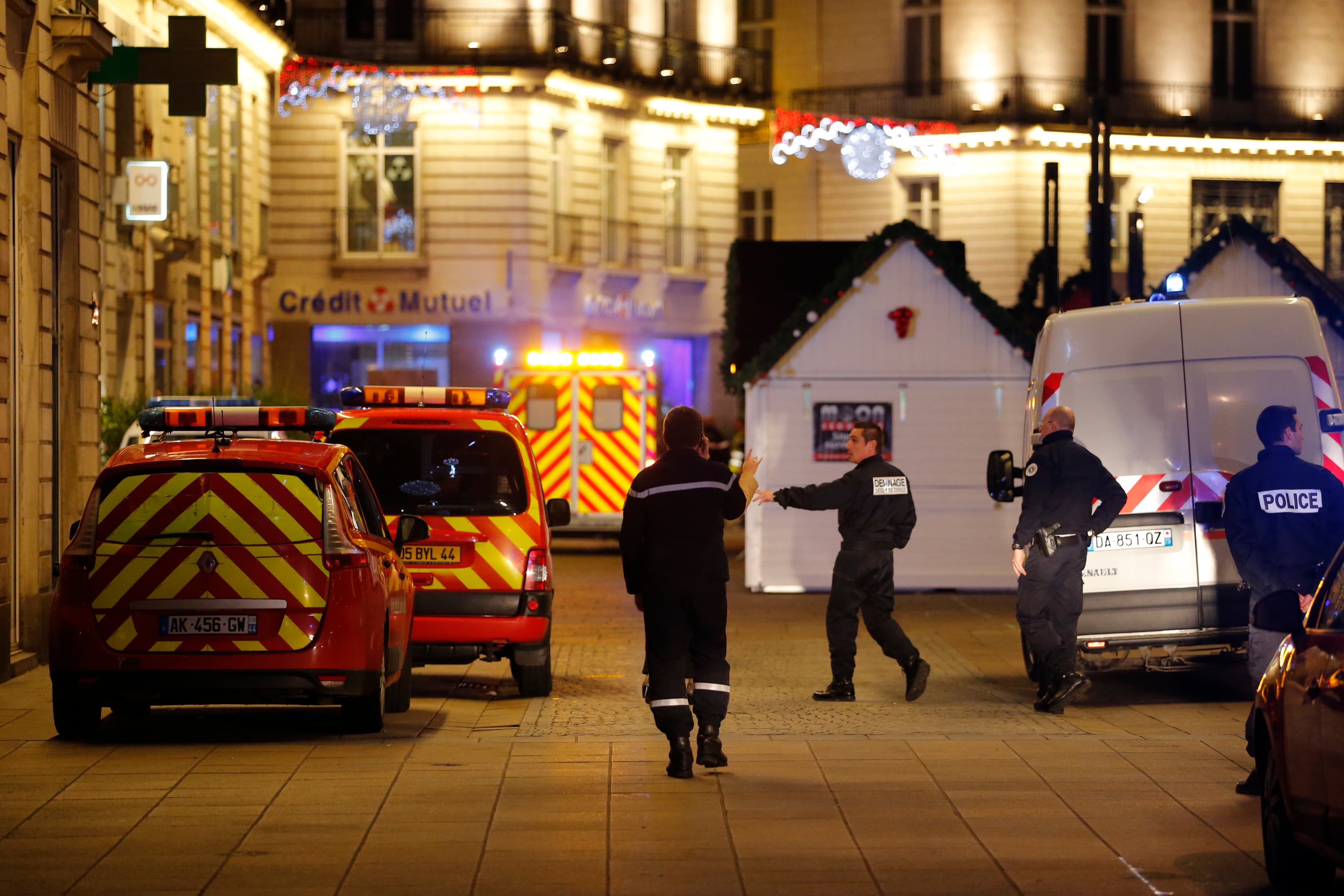 Police and rescue crews respond to the scene near where a man drove a van into a crowd, injuring 10 people, some seriously wounded, in Nantes, December 22, 2014.