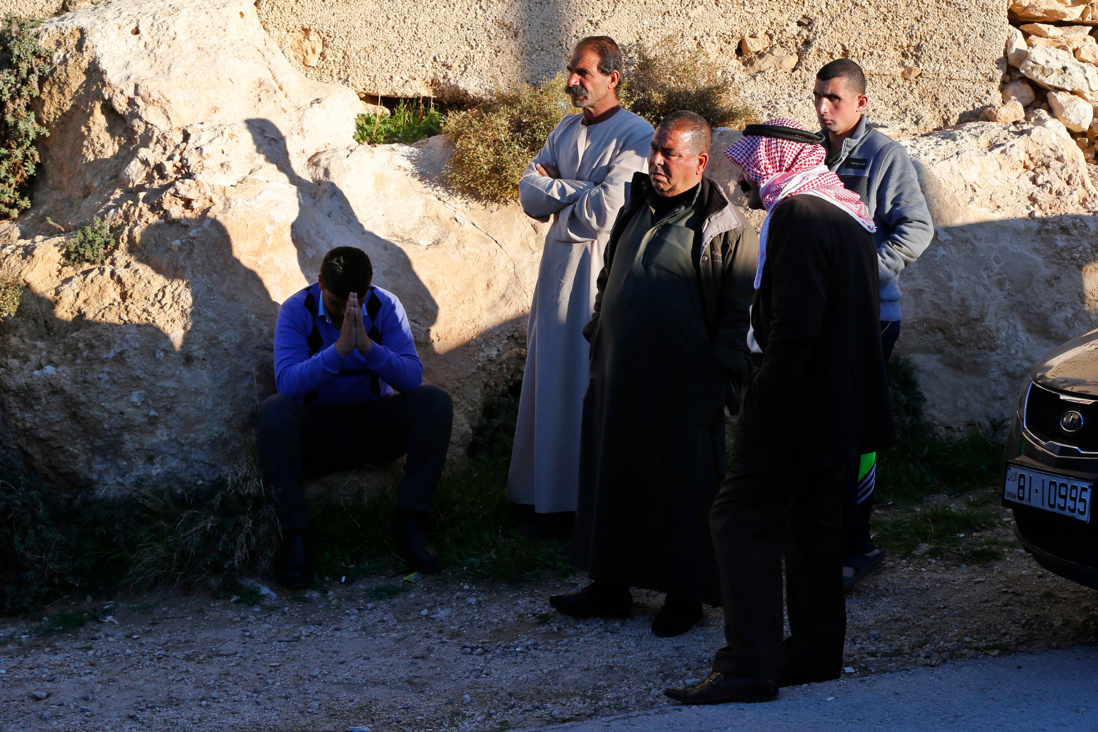 Relatives of the Jordanian pilot who was captured by ISIS forces in Syria congregate in front of his family's home in the Jordanian city of Karak on December 24, 2014.