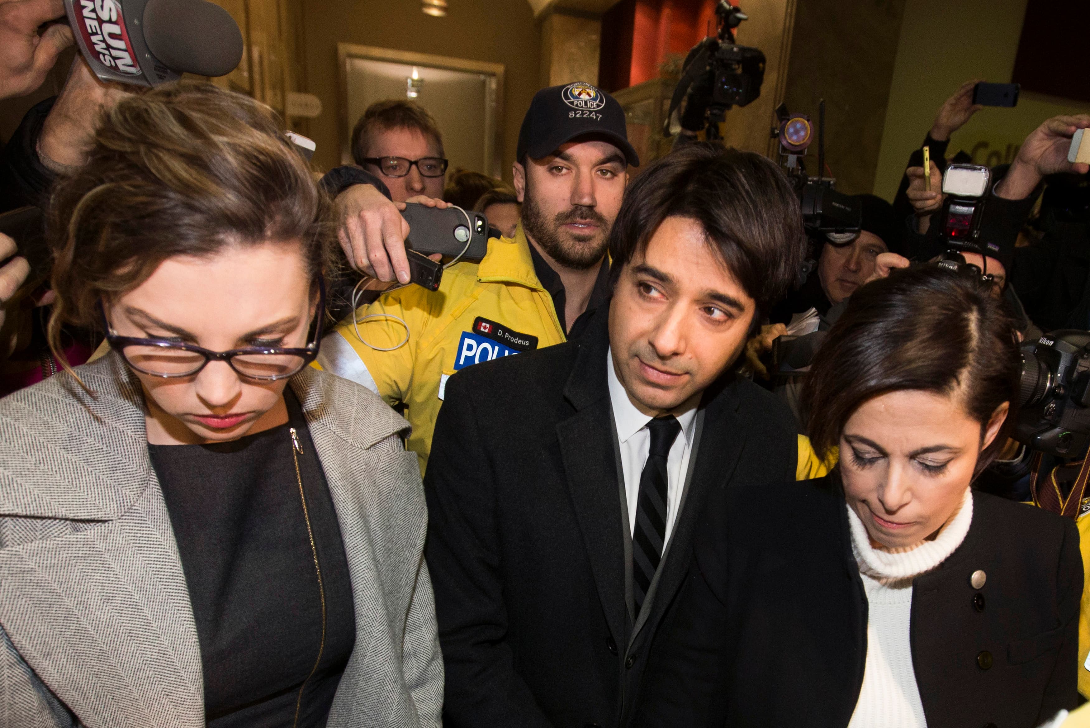 A Canadian radio talk show program is relaunching following the firing of former host Hian Ghomeshi, center, who is facing charges of harassment.