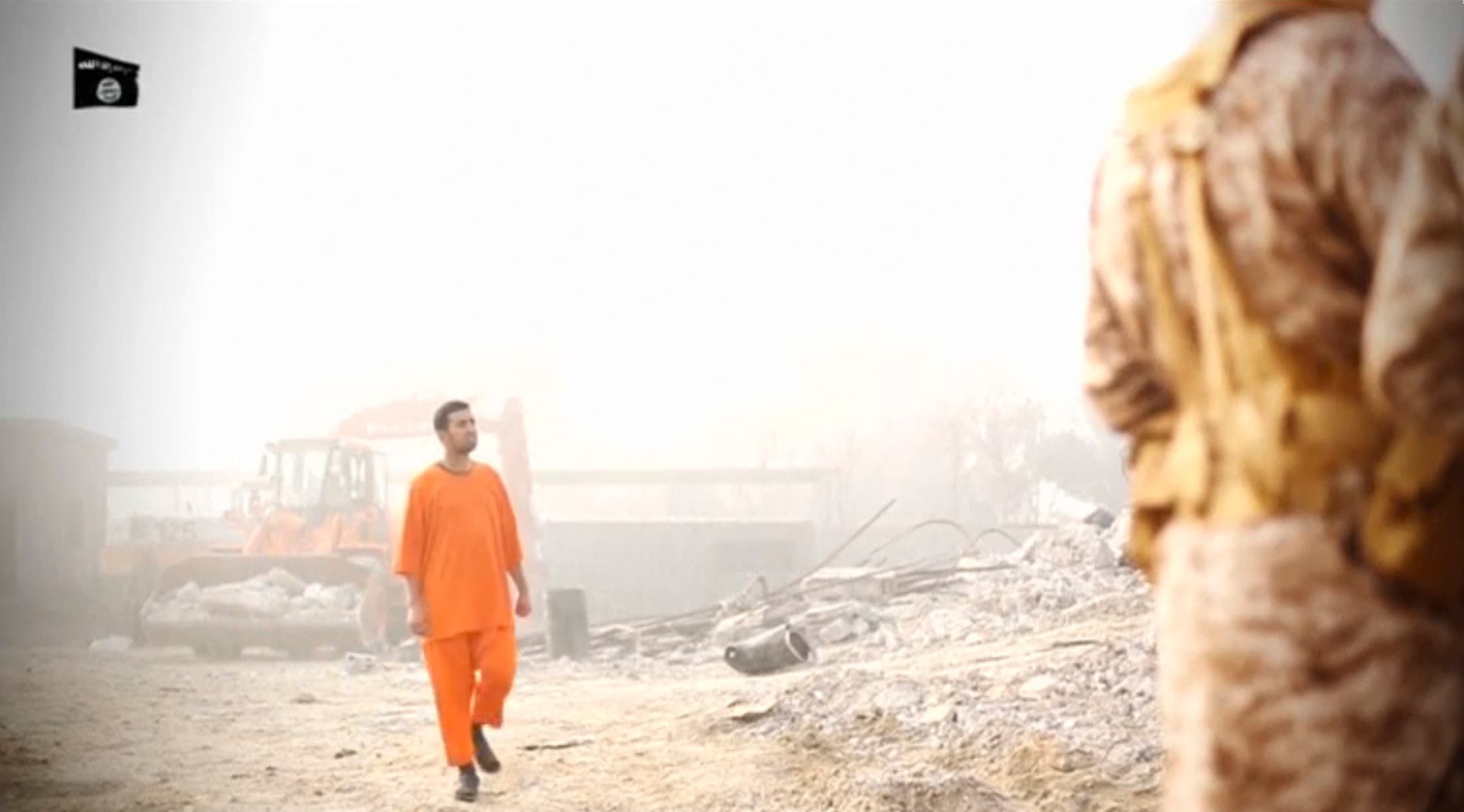 A man purported to be Jordanian Air Force Lieutenant Moaz al-Kasasbeh walks slowly toward his death in a video released by ISIS.