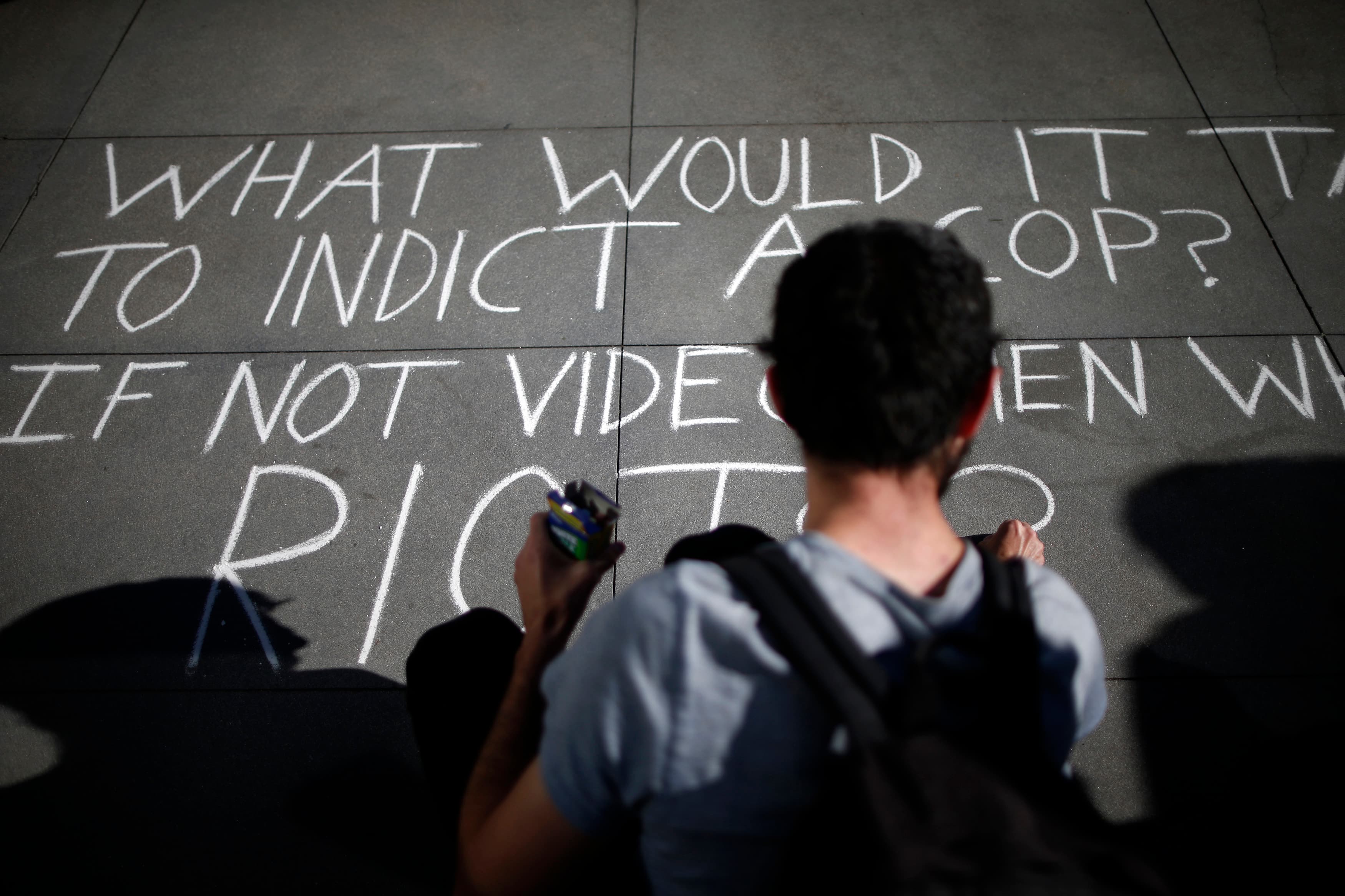 People protest against the killing of a homeless man by police outside LAPD headquarters on March 3, 2015.