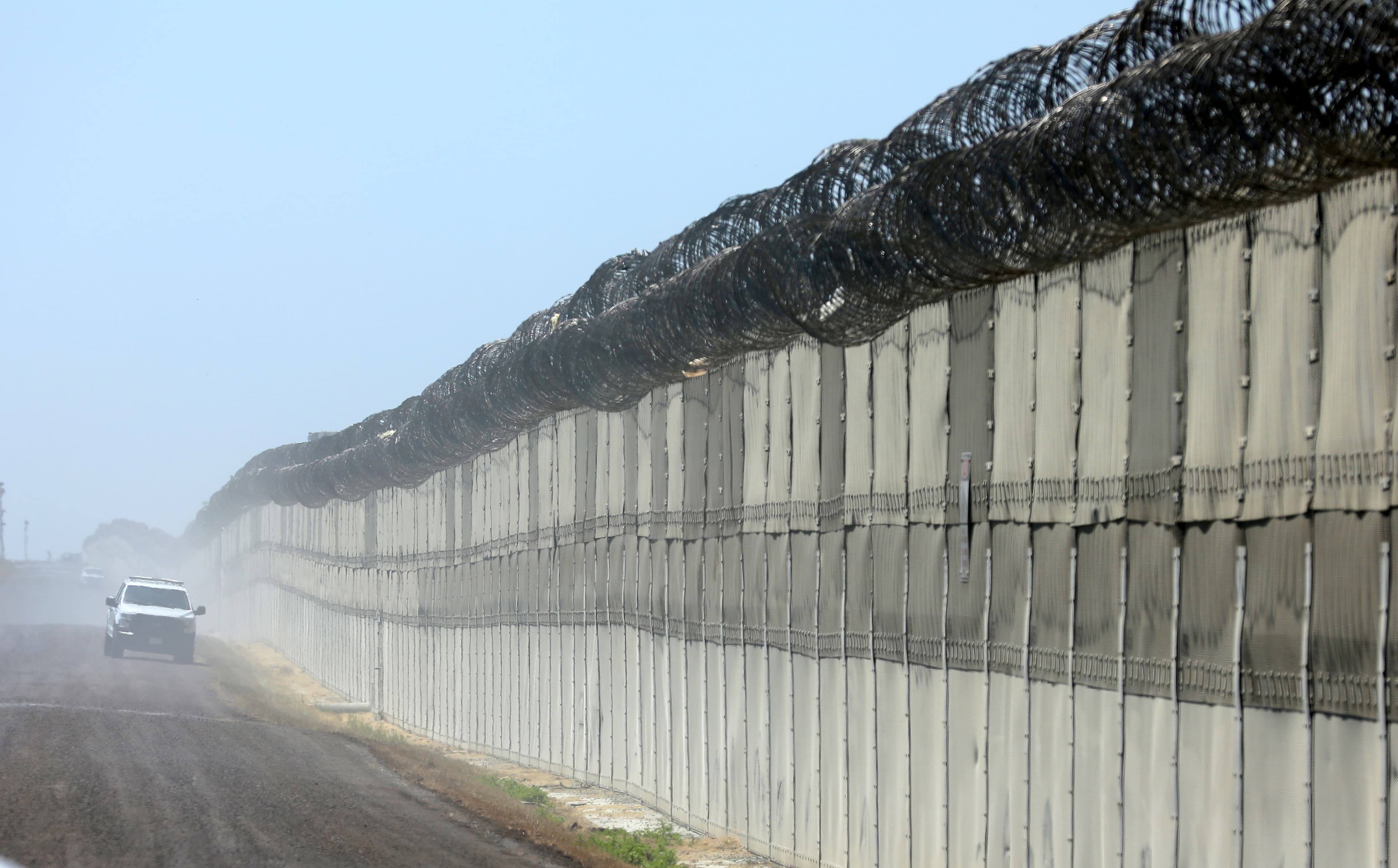 A U.S. Customs and Border Patrol officer patrols along the secondary fence between the U.S. and Mexico in San Diego, California, U.S. April 21, 2017.