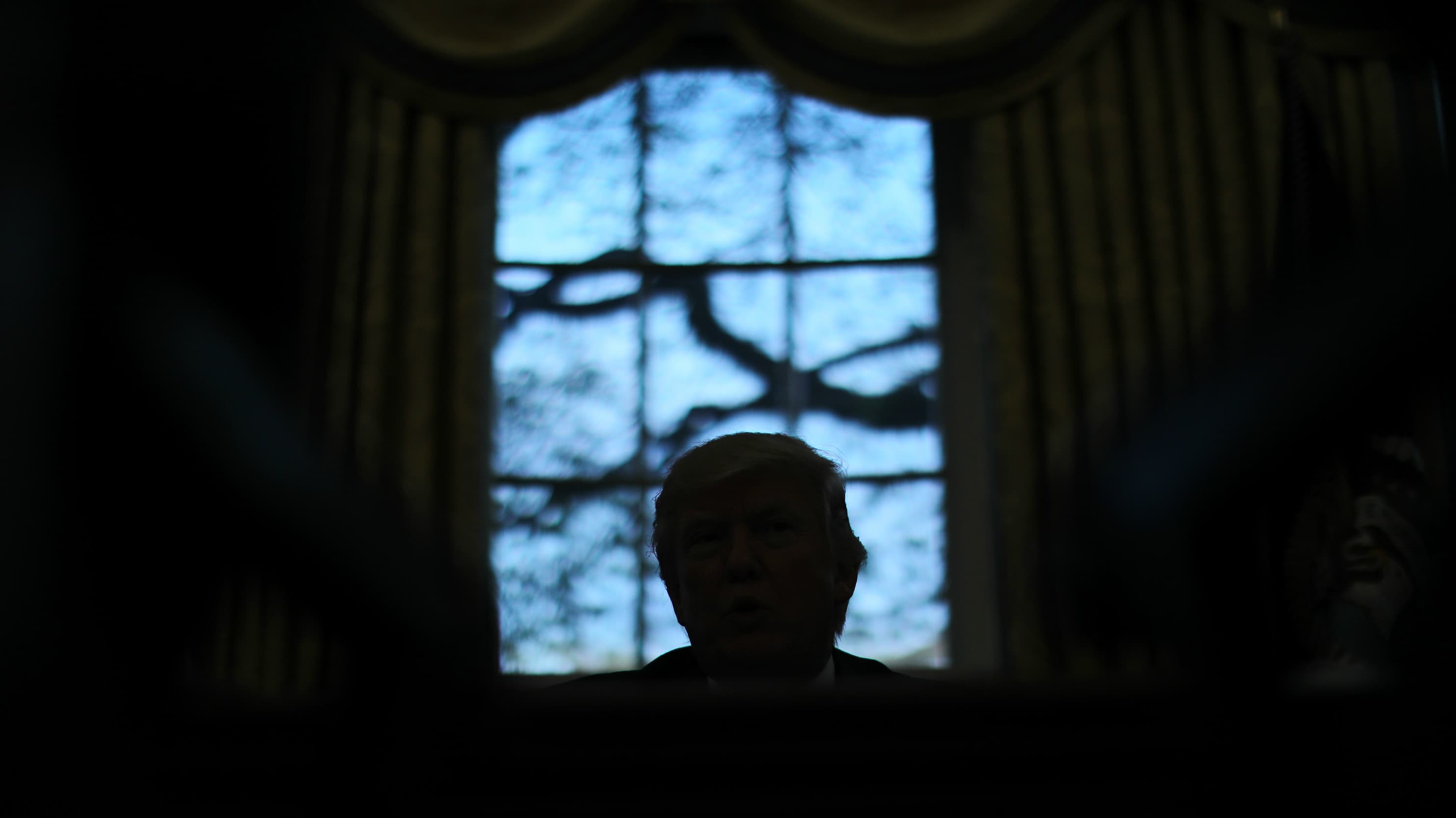 President Donald Trump sits in the Oval Office at the White House in Washington, DC, April 27, 2017.