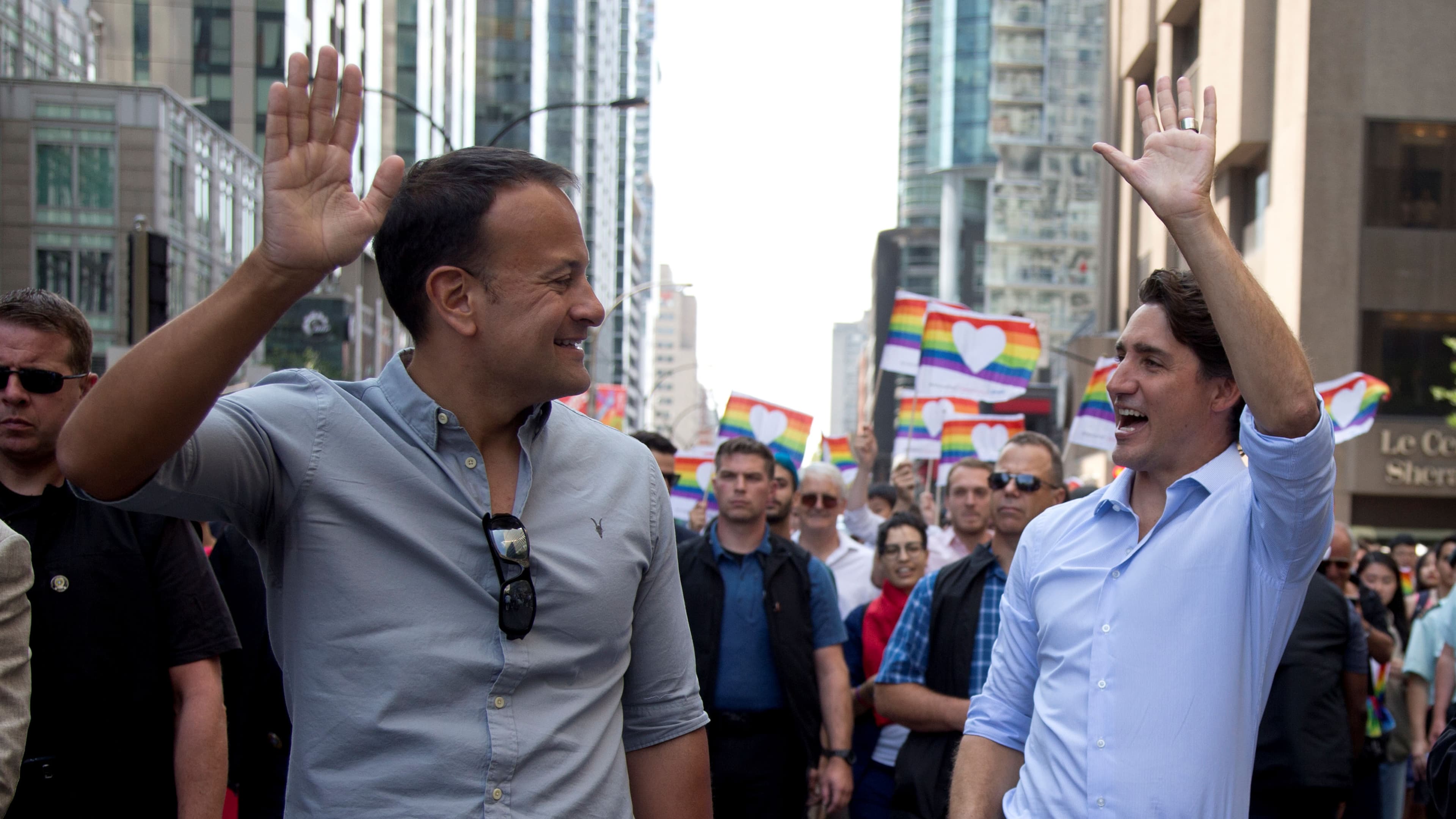 Irish Taoiseach Leo Varadkar (left) walks with Canada's Prime Minister Justin Trudeau (right) during the Montreal Pride parade in Montreal, Aug. 20, 2017.