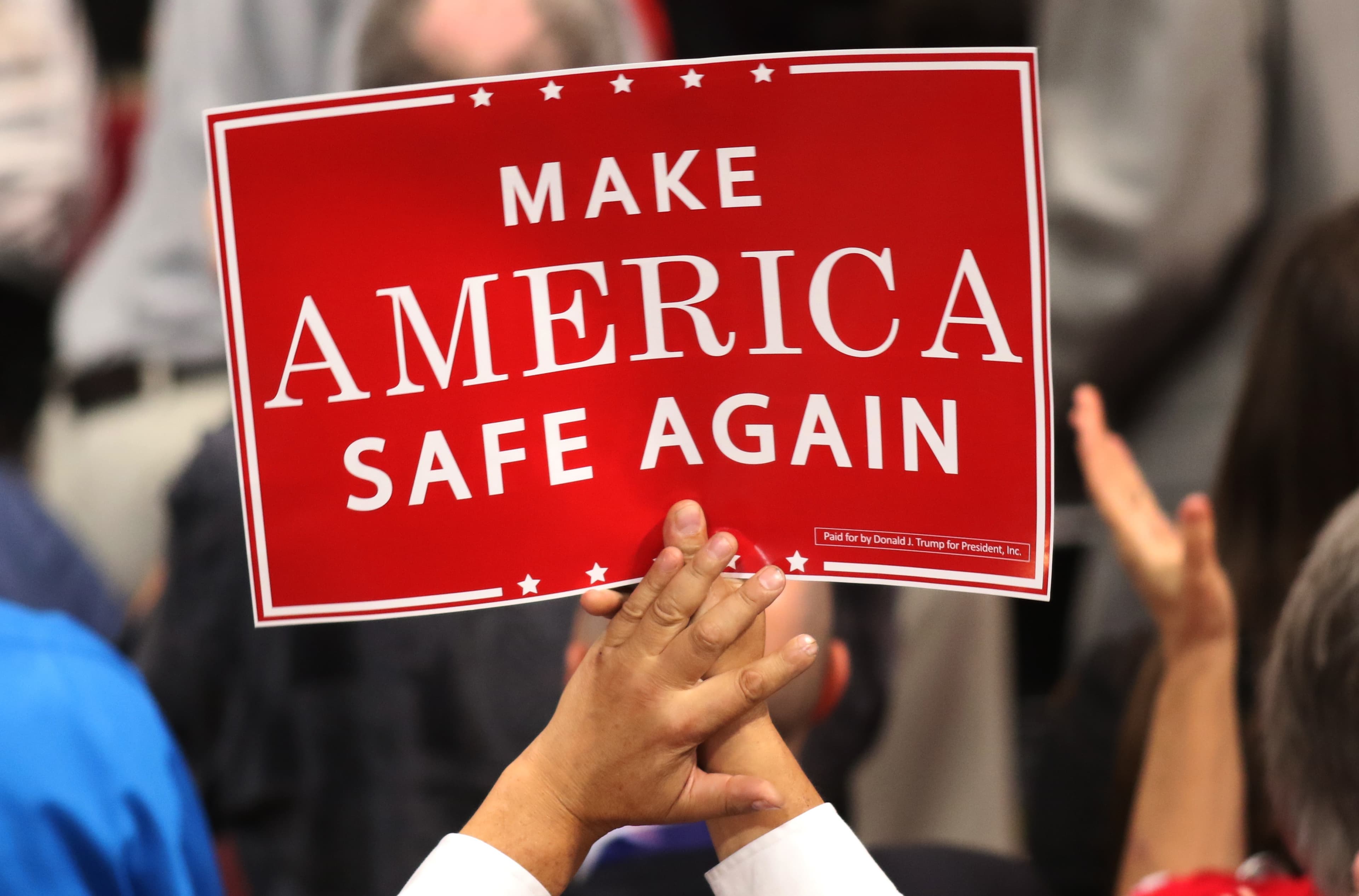 A delegate holds a sign during first-night speeches at the Republican National Convention in Cleveland, Ohio.