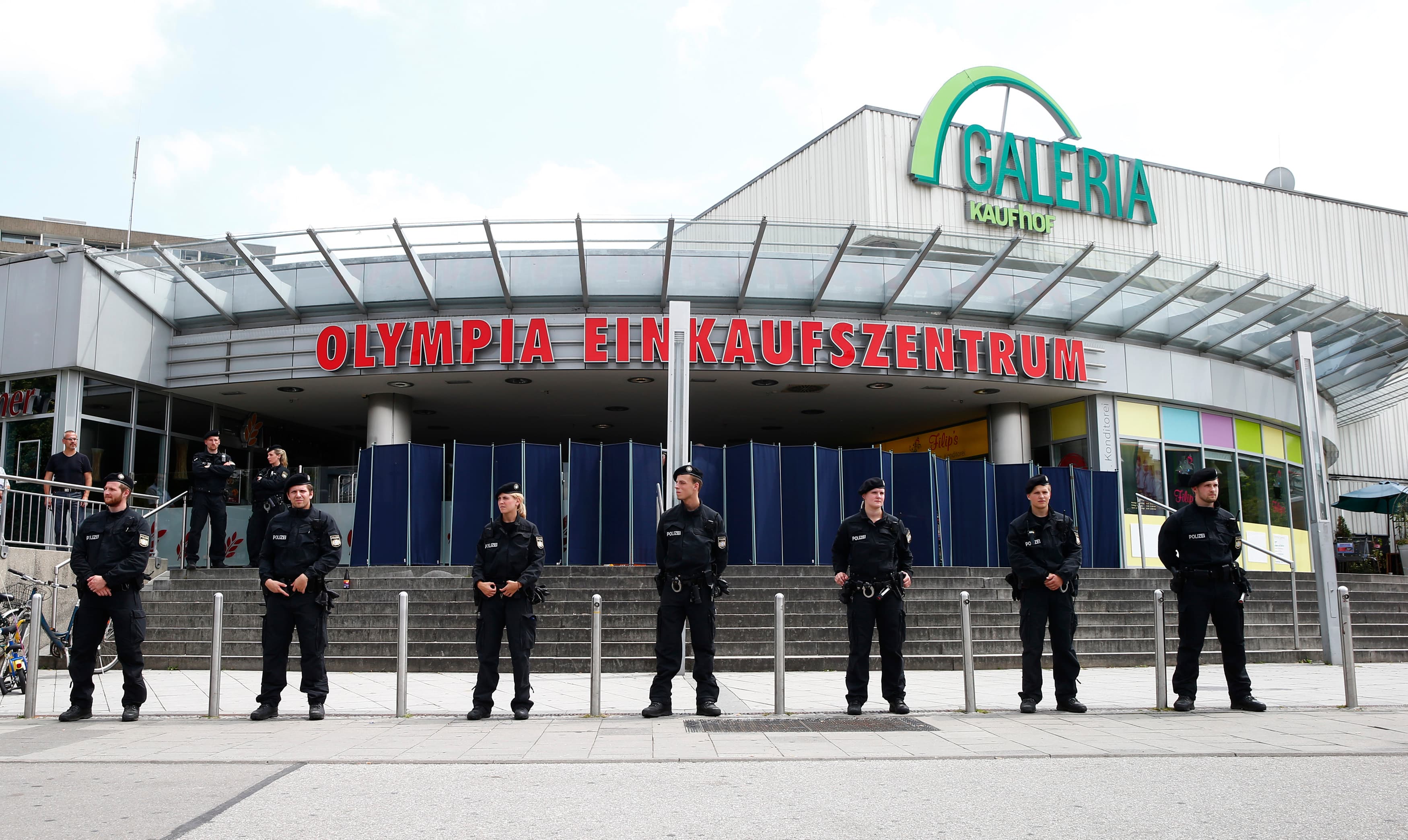 Police stand guard outside the Olympia shopping mall, where last week's shooting rampage started, in Munich, Germany July 23, 2016