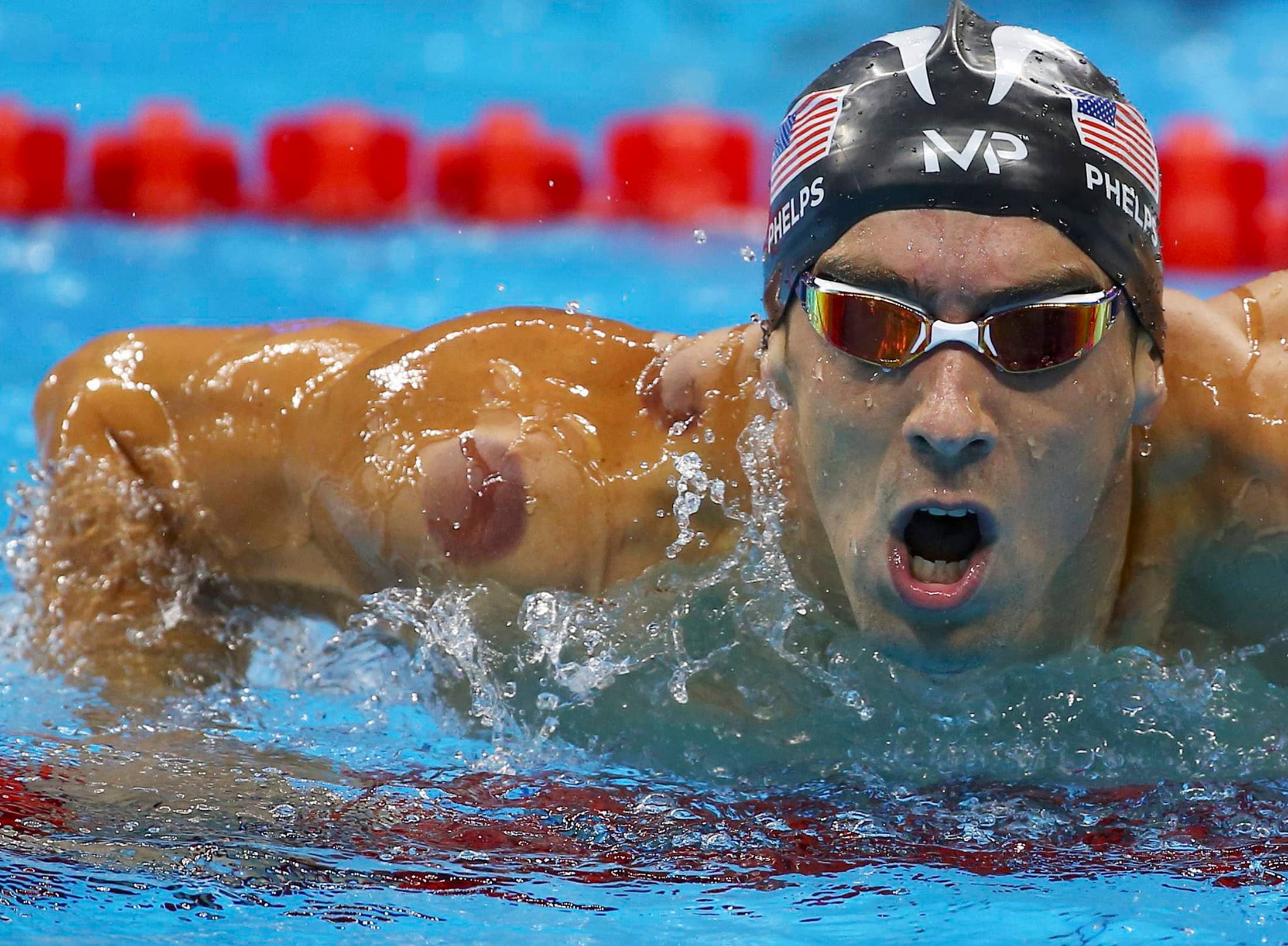 Michael Phelps of the US is seen with a red cupping mark on his shoulder as he competes in the Men's 4 x 100m Freestyle Relay Final at the 2016 Rio Olympics in Rio de Janeiro, Brazil August 7, 2016. . REUTERS/Dominic Ebenbichler