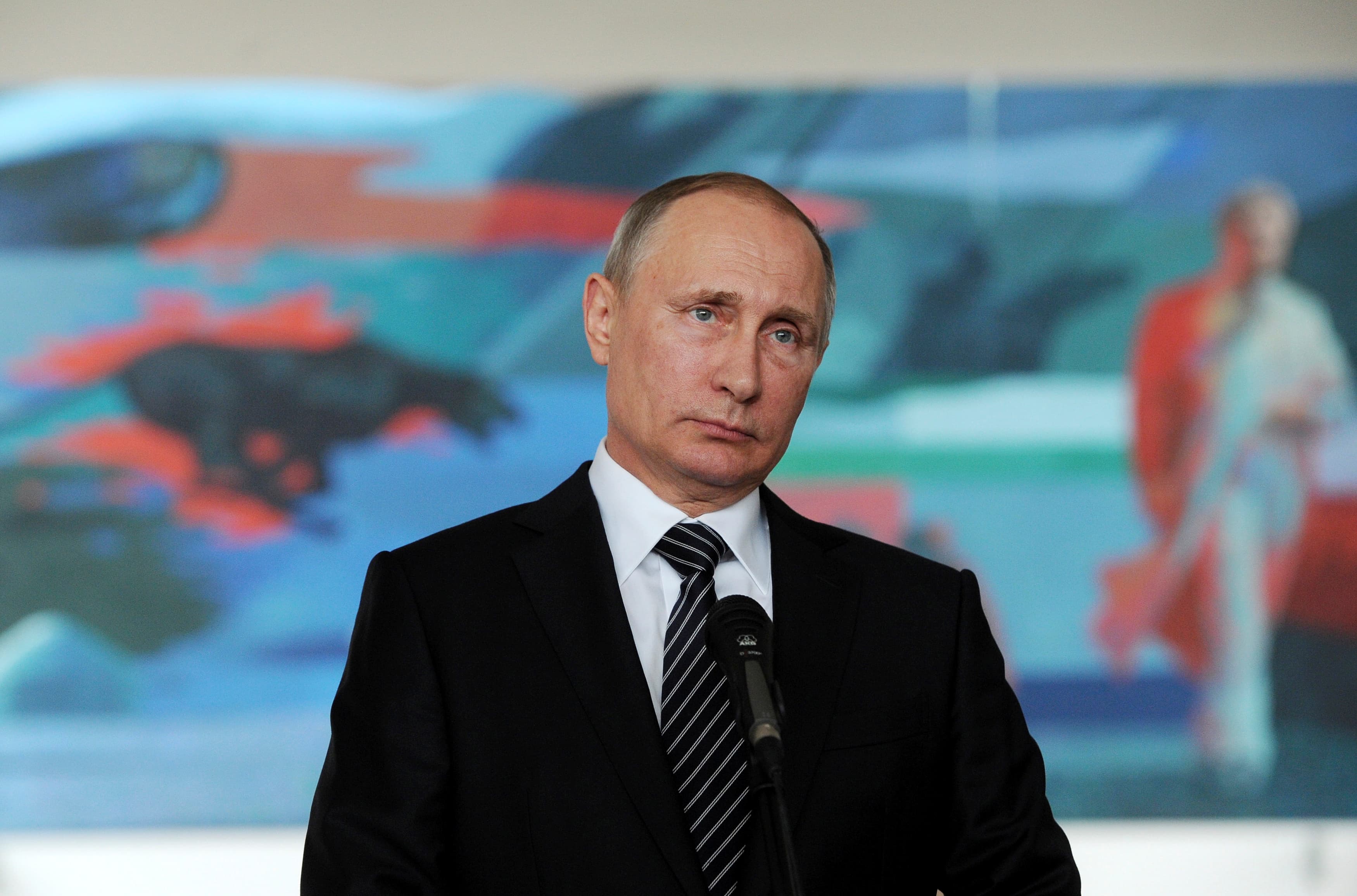 Russian President Vladimir Putin meets with reporters during a visit for a summit of former Soviet republics at Kyrgyzstan's international Manas airport outside Bishkek, Kyrgyzstan, September 17, 2016.