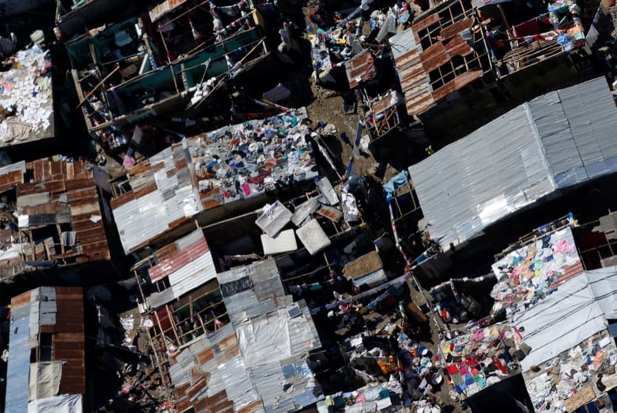 Clothes and mattresses are set out to dry on the roofs of destroyed houses after Hurricane Matthew passes in Jeremie, Haiti, on Oct. 8.