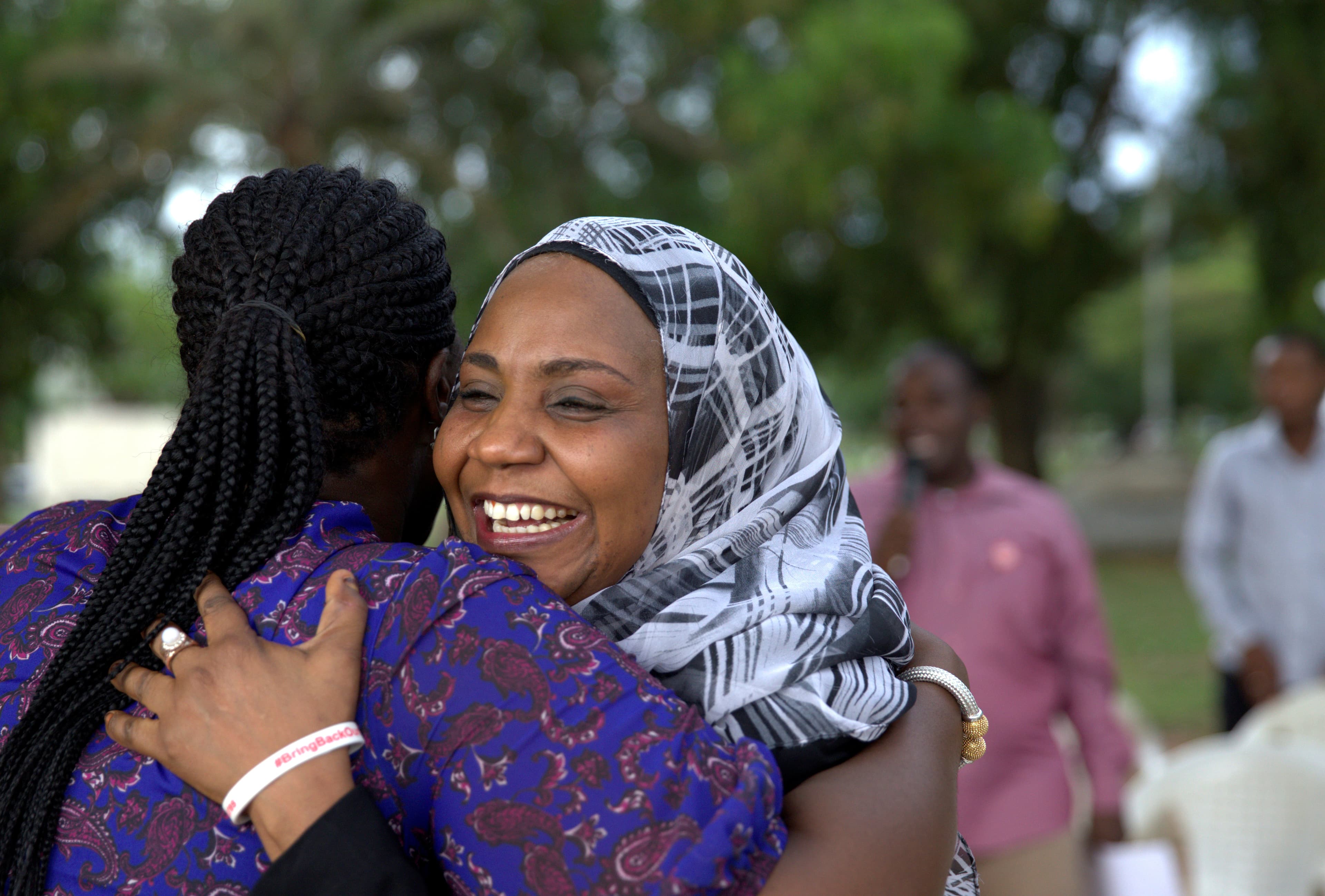 Members of the "Bring Back Our Girls" campaign celebrate news that Boko Haram extremists have released 21 young captives.