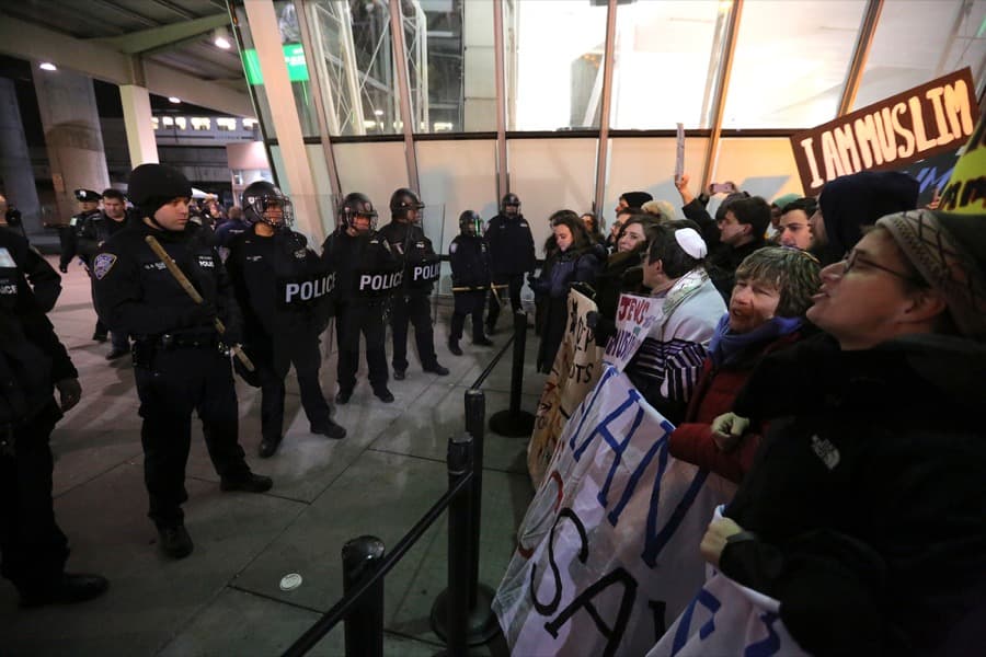 Protesters gather outside Terminal 4 at John F. Kennedy airport in opposition to President Donald Trump's proposed ban on immigration in Queens, New York City, on Jan. 28.