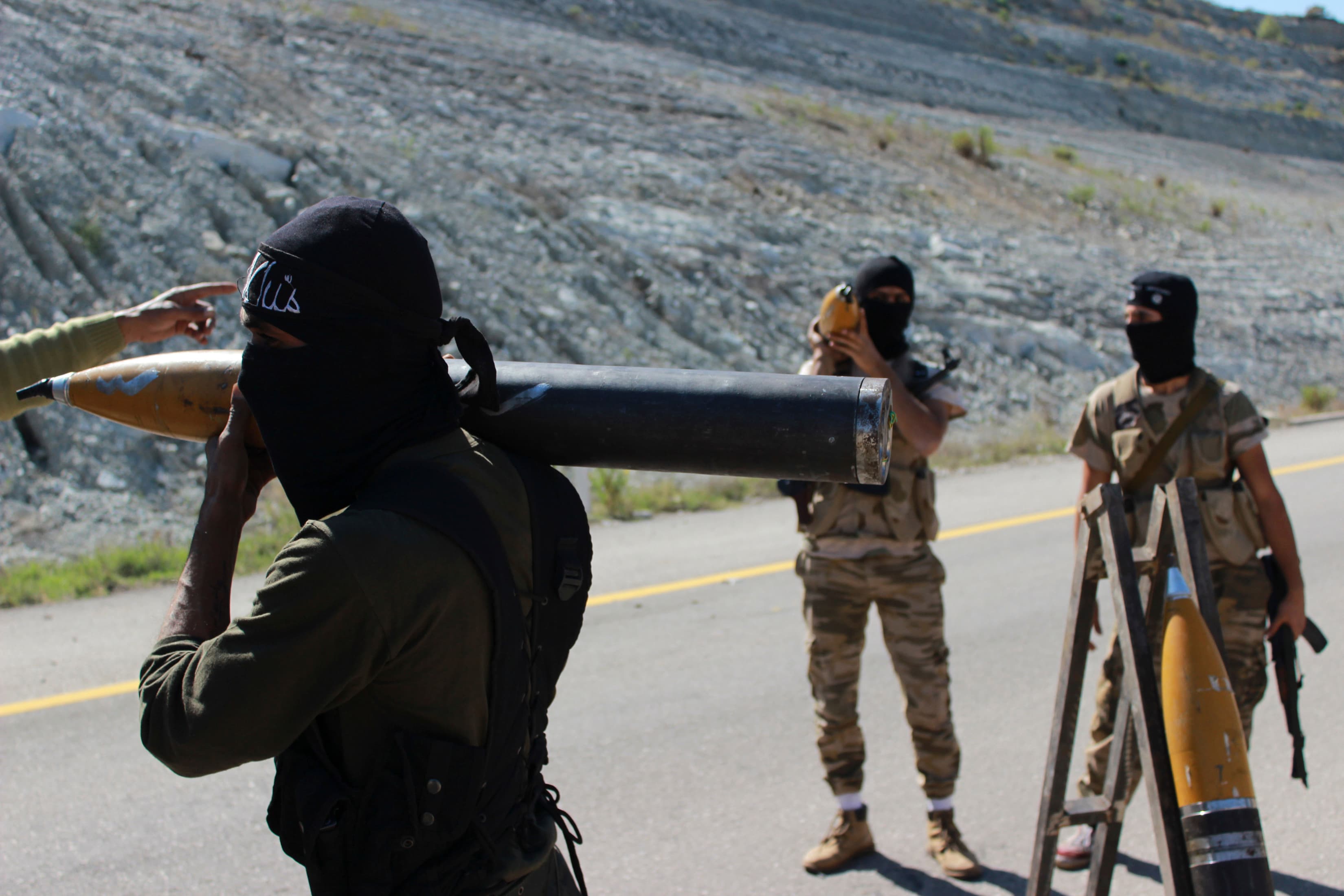 Free Syrian Army fighters prepare rockets