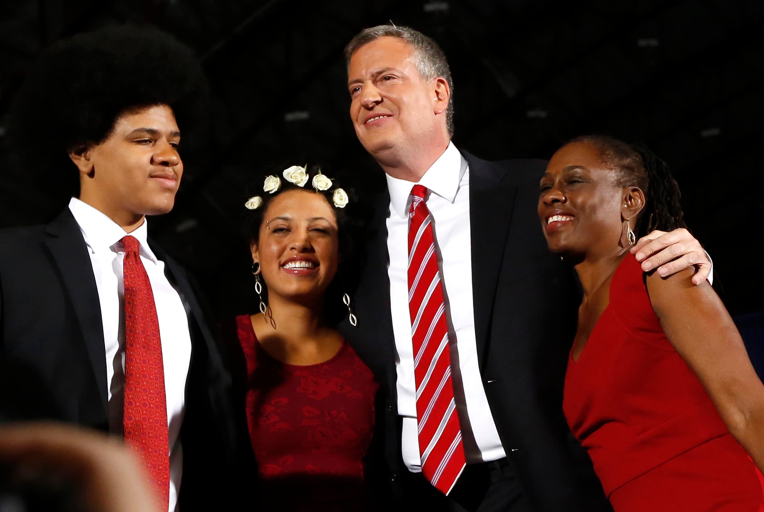 Democrat Bill de Blasio (2nd R) hugs his wife Chirlane McCray (R) and children Chiara and Dante