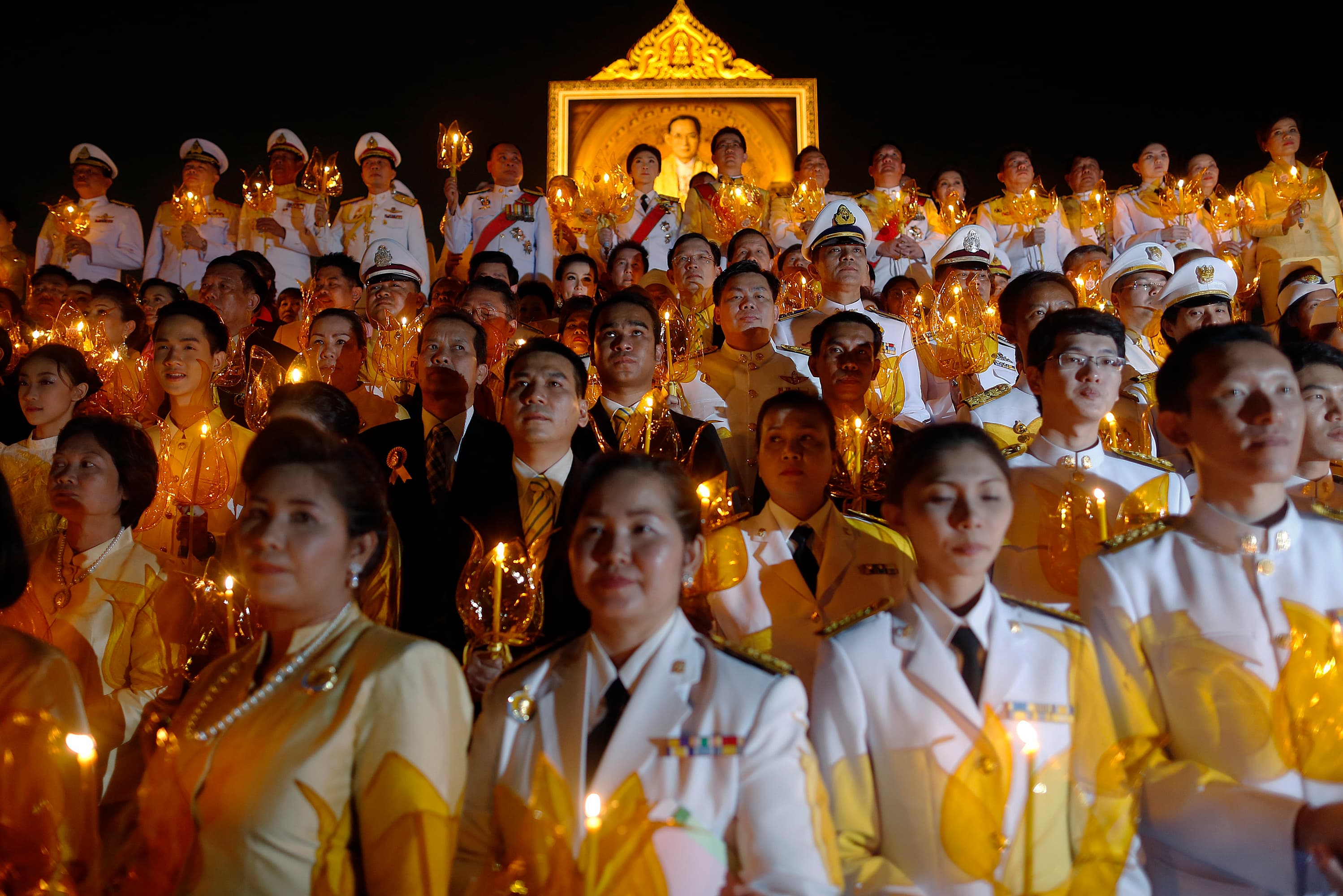 Well wishers, including Thai Prime Minister Yingluck Shinawatra (top C), attend birthday celebrations for Thailand's revered King Bhumibol Adulyadej in Bangkok on December 5, 2013.