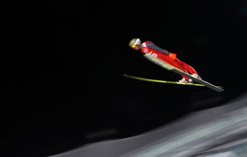 Preliminary events got underway in Sochi Thursday. Here, Poland's Kamil Stoch soars through the air during the men's ski jumping individual normal hill training event. But much attention is still focused on security.