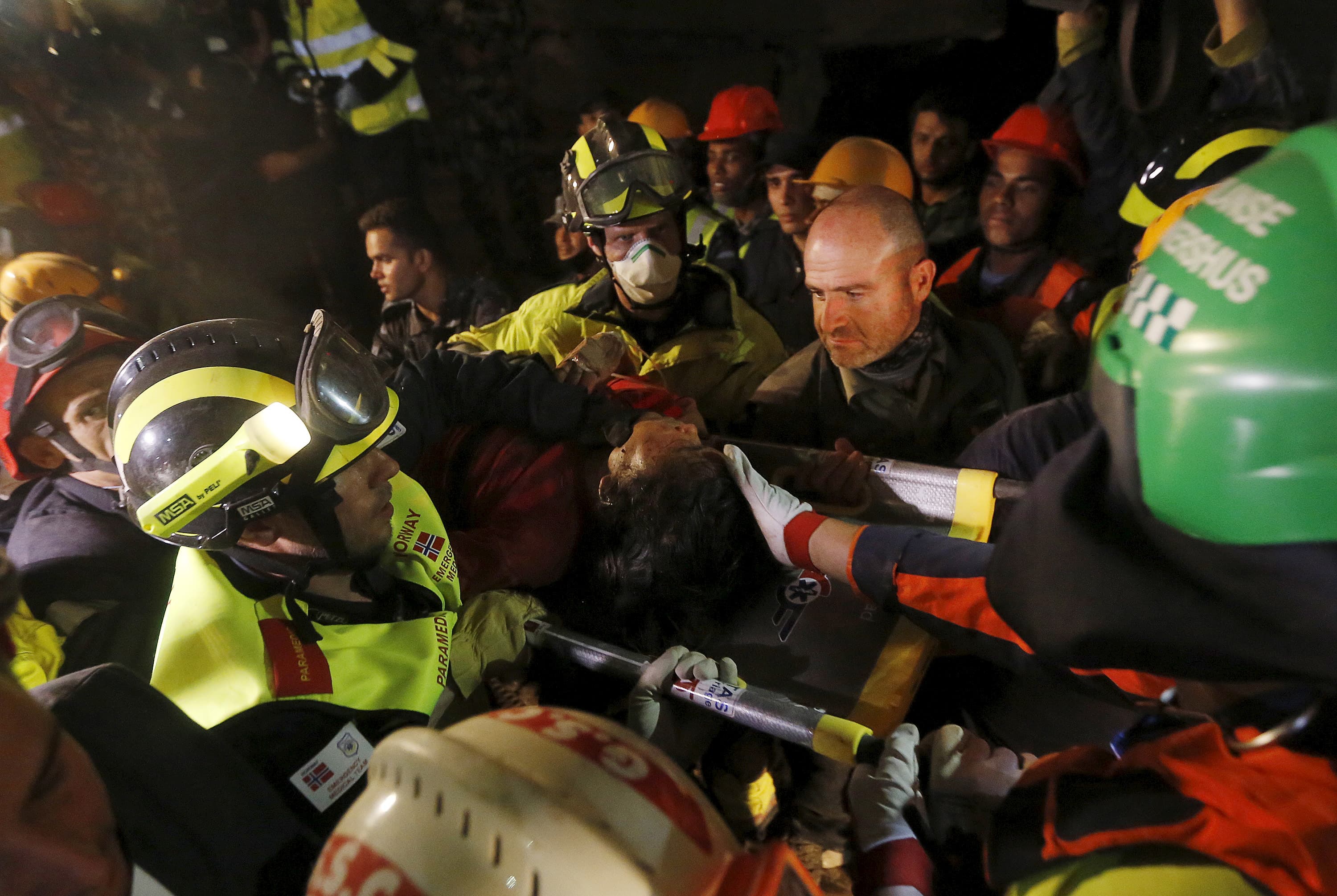 Earthquake survivor Krishna Kumari Khadka is rescued from a collapsed building in Kathmandu by French, Israeli and Norwegian rescue teams six days after the April 25, 2015 earthquake in Nepal.