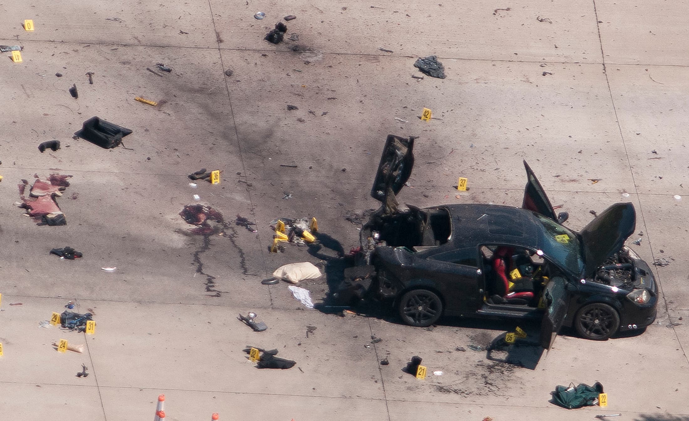 An aerial view shows the car that was used the previous night by two gunmen, who were killed by police, as it is investigated by local police and the FBI in Garland, Texas May 4, 2015.