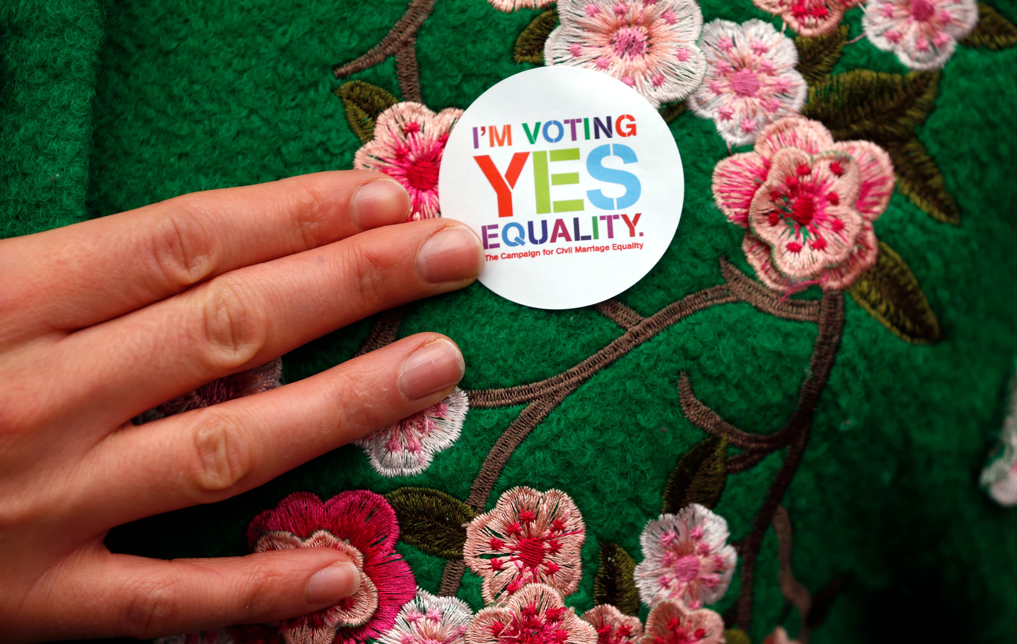 A Yes supporter shows of her campaign badge in central Dublin in Ireland May 21, 2015. Irish Prime Minister Enda Kenny said on Sunday that Ireland must seize its opportunity to become the first count