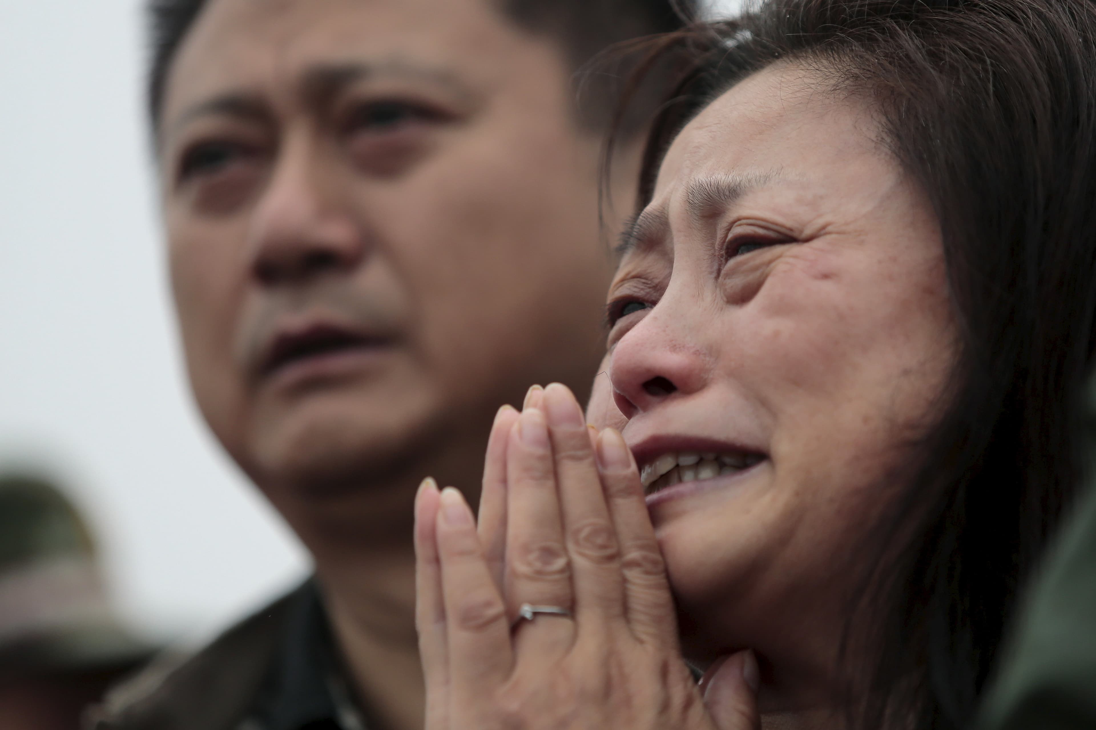 A relative of a missing passenger aboard the capsized ship Eastern Star cries on the banks of the Jianli section of Yangtze River in Hubei province, China, June 4, 2015.