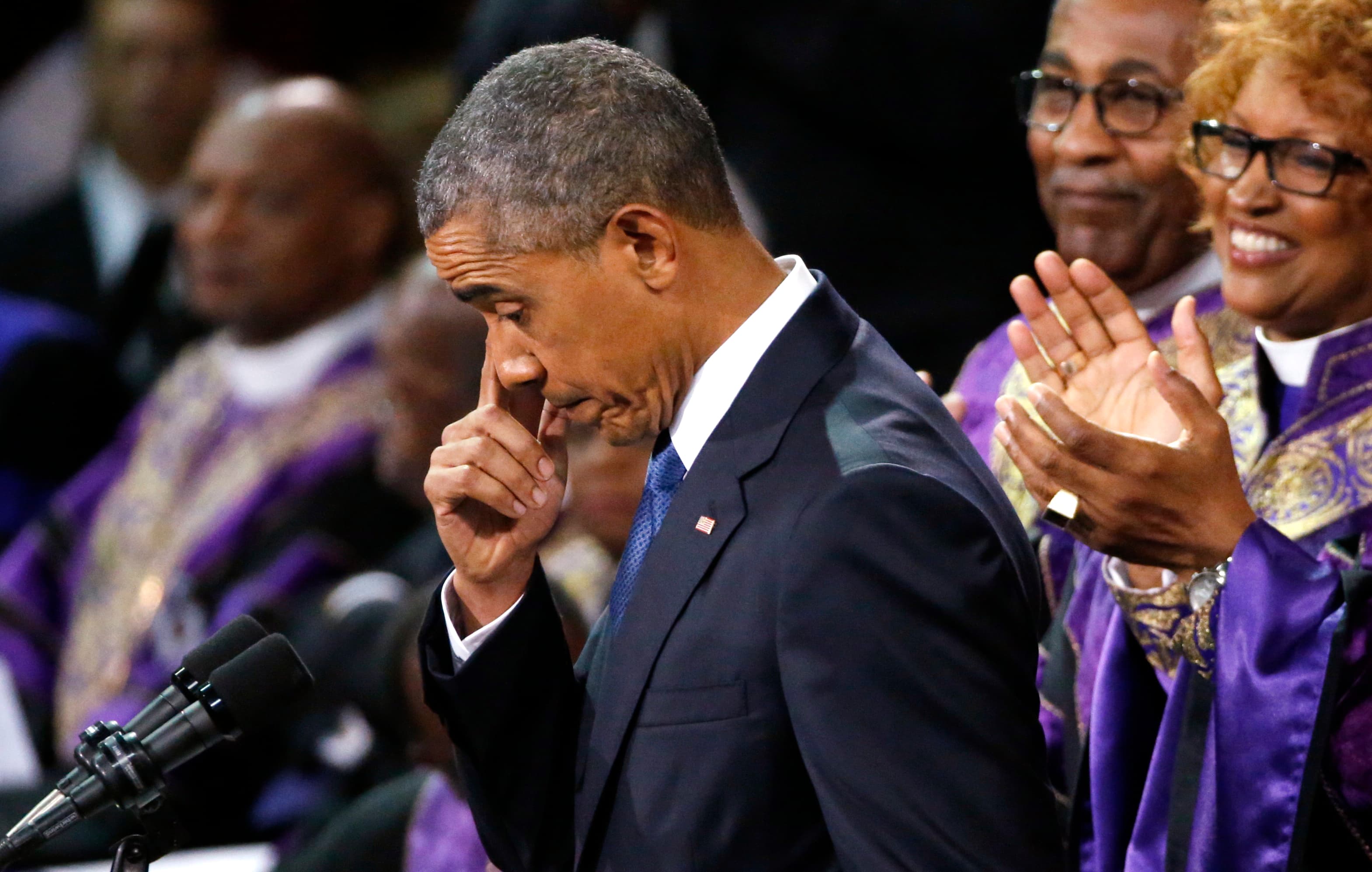 President Barack Obama pauses during his eulogy for one of the victims slain in a Charlestown, South Carolina, church by an avowed white supremacist