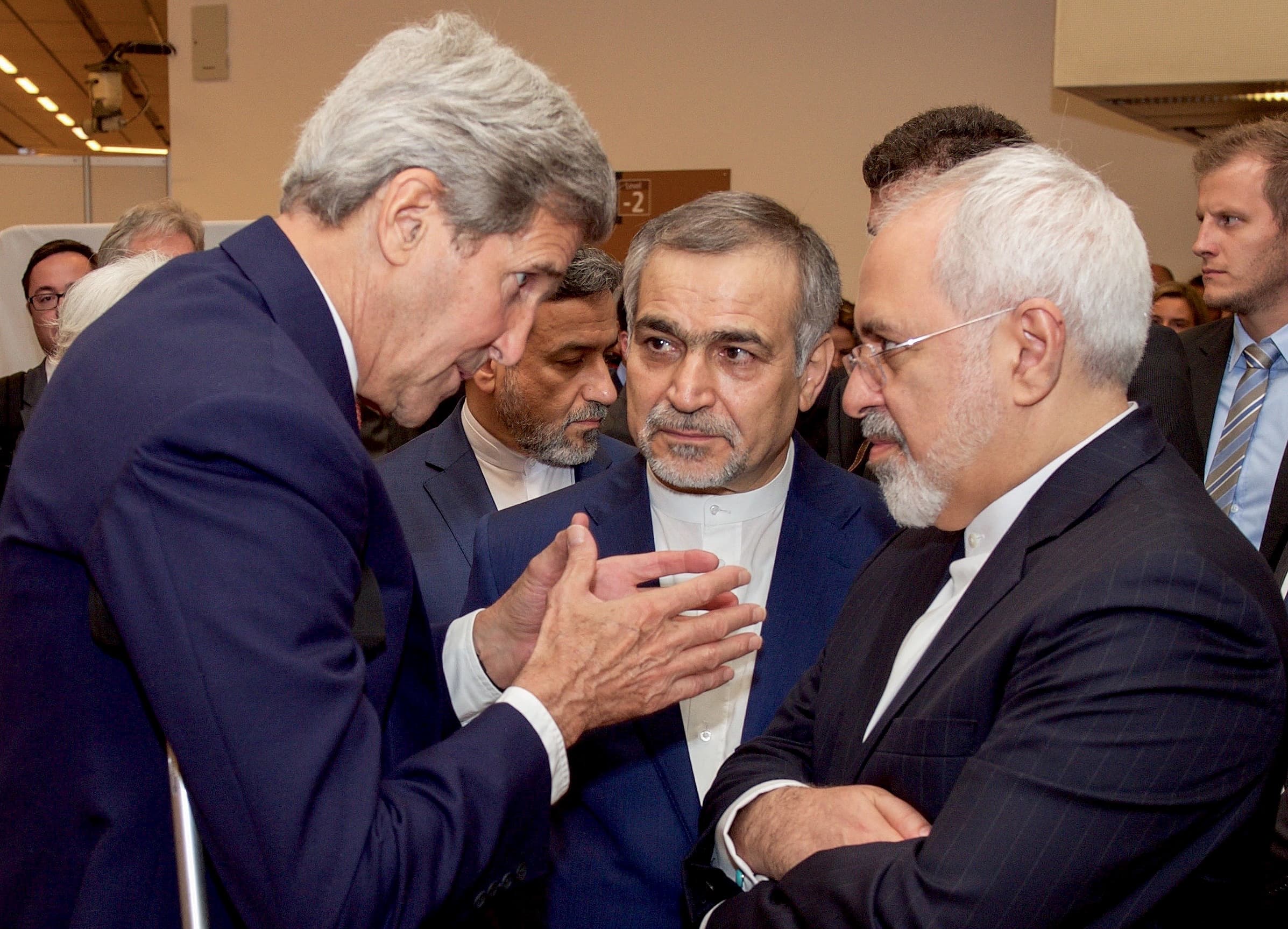 US Secretary of State John Kerry (L) speaks with Hossein Fereydoun (C), the brother of Iranian President Hassan Rouhani, and Iranian Foreign Minister Javad Zarif (R), before the Secretary and Foreign Minister addressed an international press corps gathere