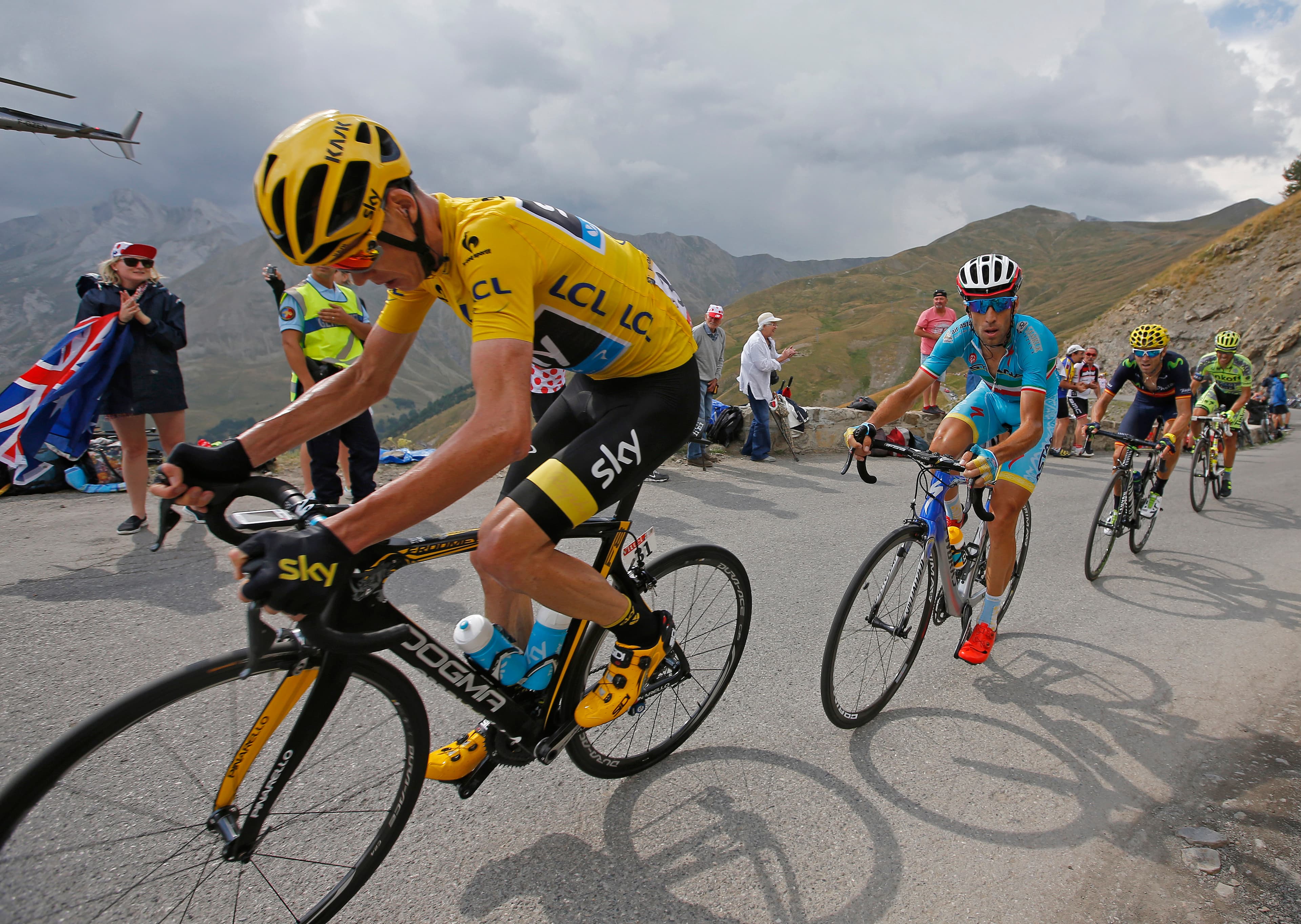 Team Sky rider Chris Froome of Britain (L), race leader's yellow jersey, climbs the Allos pass followed by Astana rider Vincenzo Nibali of Italy during the 161-km (100 miles) 17th stage of the 102nd Tour de France cycling race from Digne-les-Bains to Pra