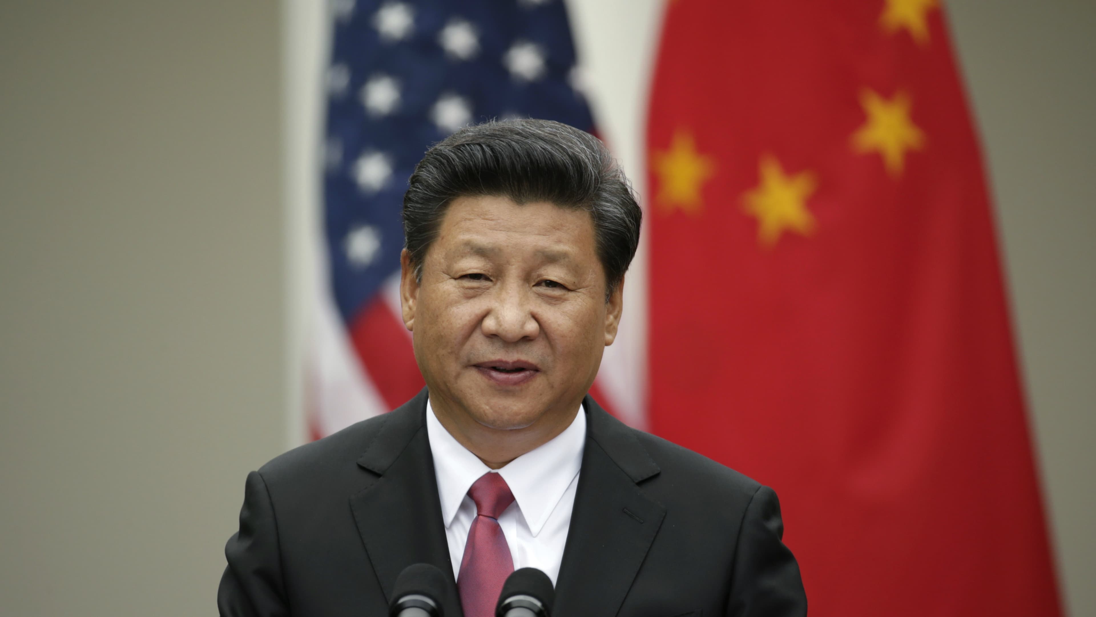 Chinese President Xi Jinping addresses a joint news conference with US President Barack Obama in the Rose Garden at the White House in Washington, DC, Sept. 25, 2015.