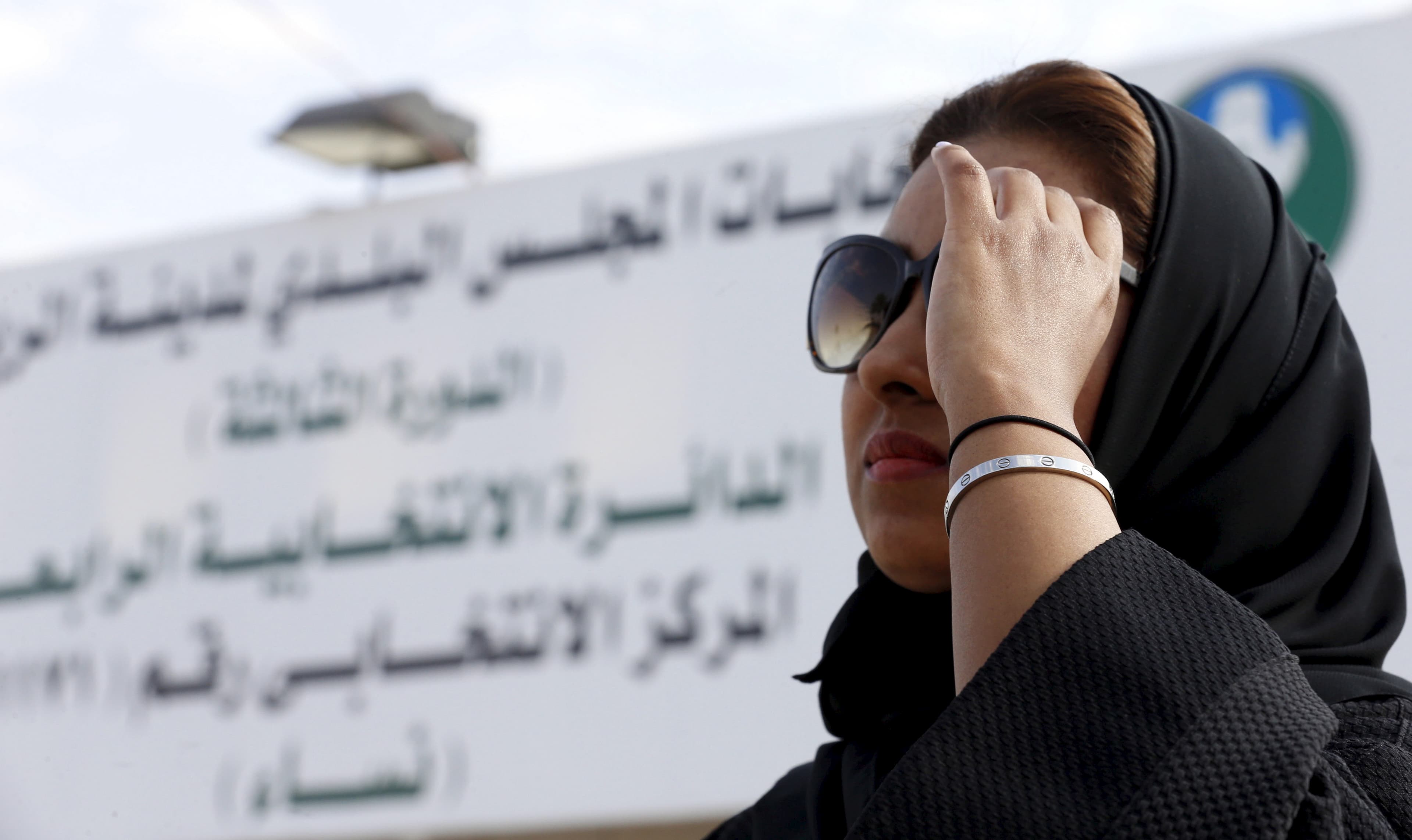 A woman leaves a polling station after casting her vote during municipal elections, in Riyadh, Saudi Arabia December 12, 2015