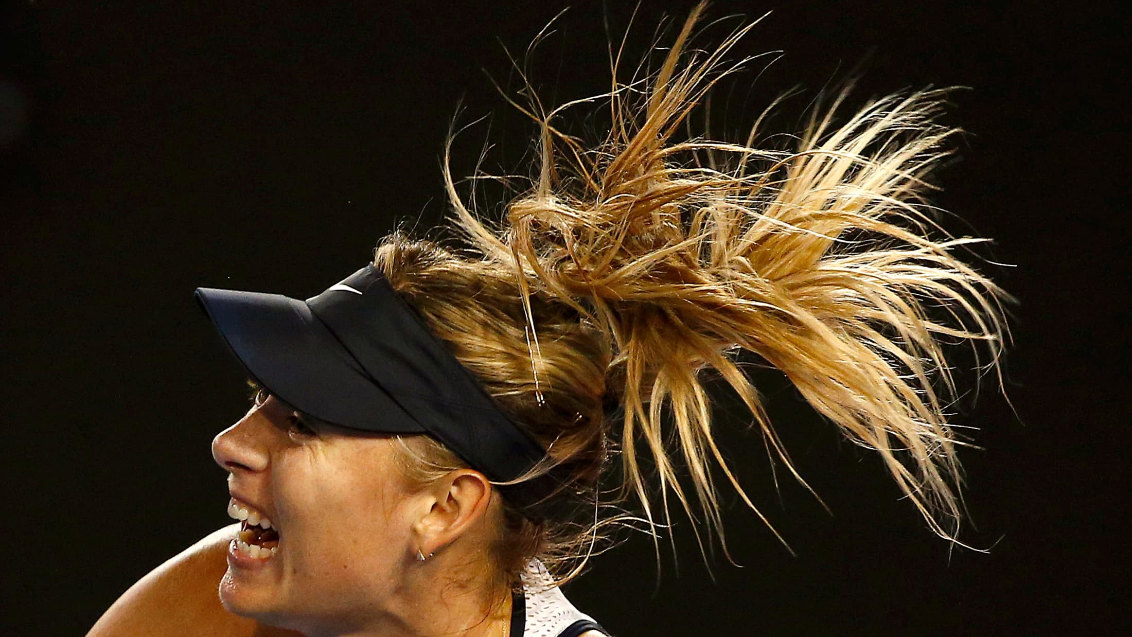 Russia's Maria Sharapova serves during her third round match against Lauren Davis of the U.S. at the Australian Open tennis tournament at Melbourne Park, Australia, January 22, 2016.