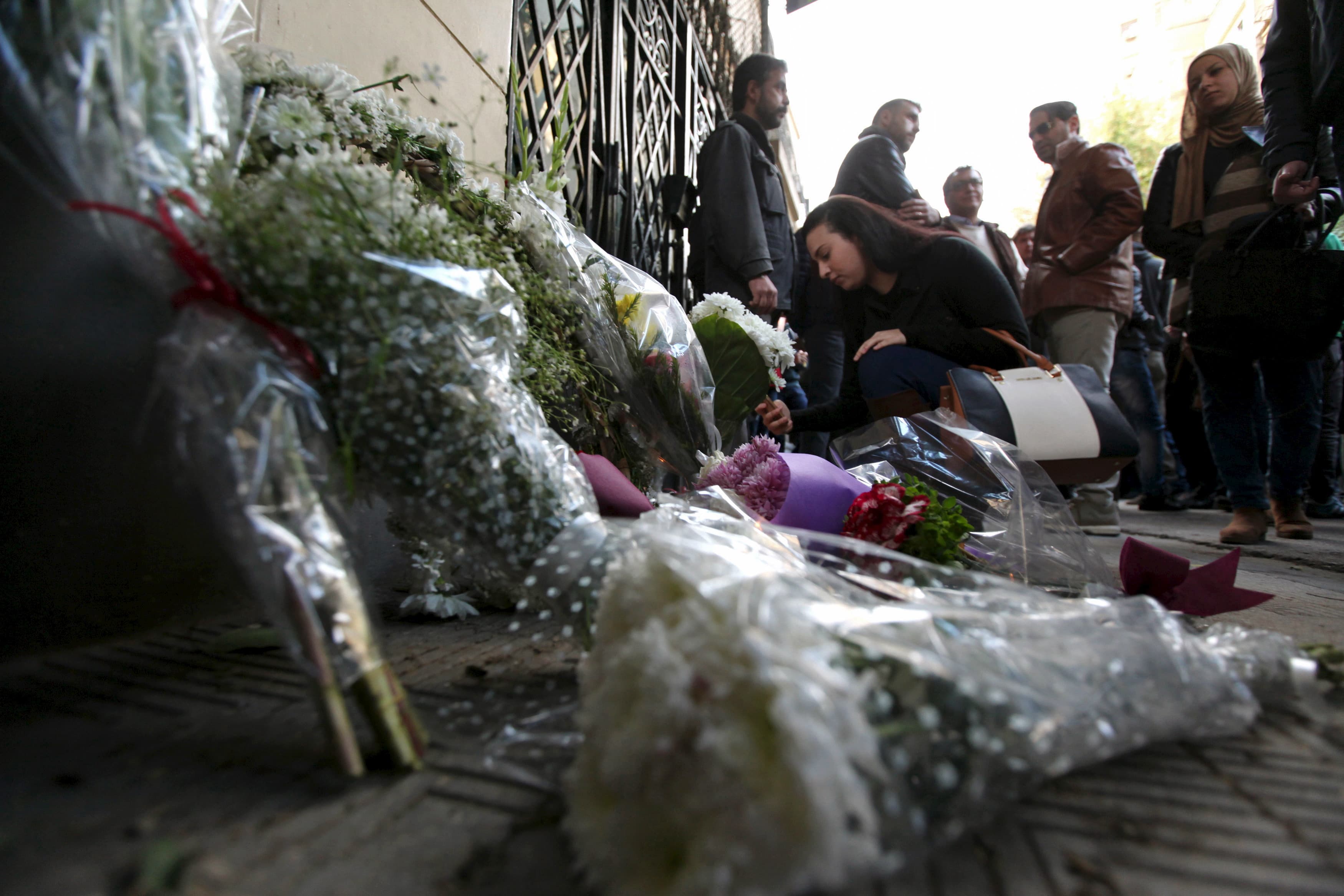 People attend a memorial for Giulio Regeni outside the Italian embassy in Cairo, Egypt, February 6, 2016.