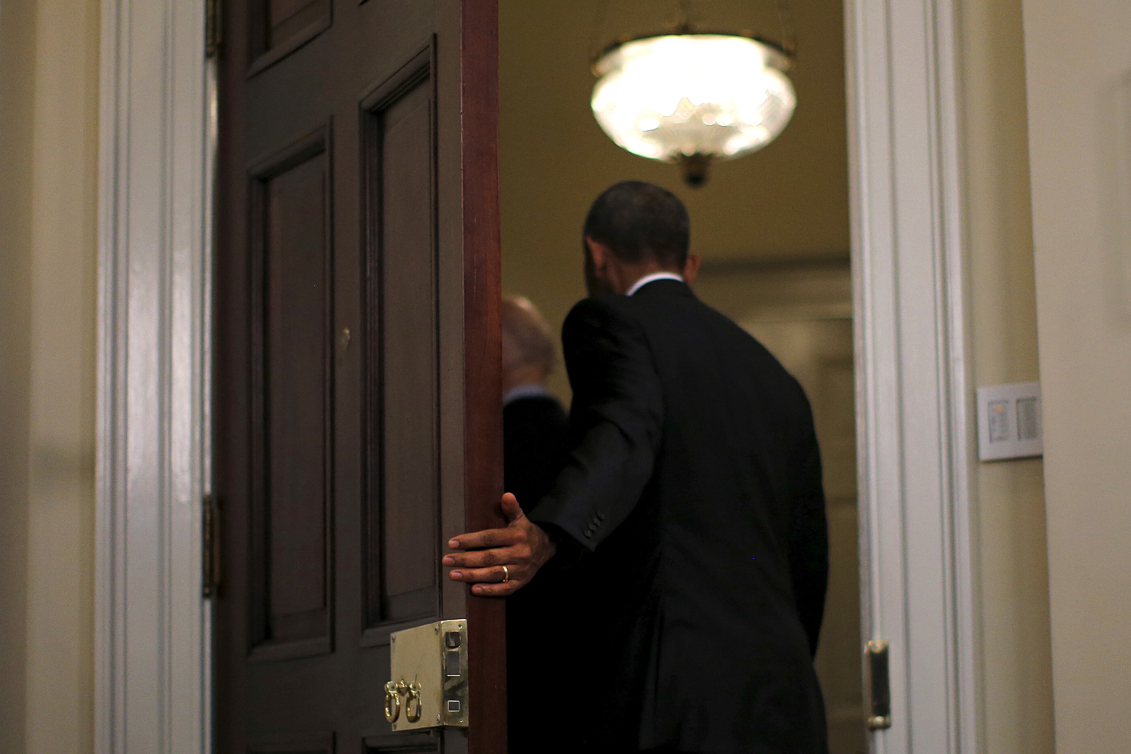 President Barack Obama and Vice President Joe Biden leave the Roosevelt room after delivering a statement on Guantanamo at the White House in Washington February 23, 2016.