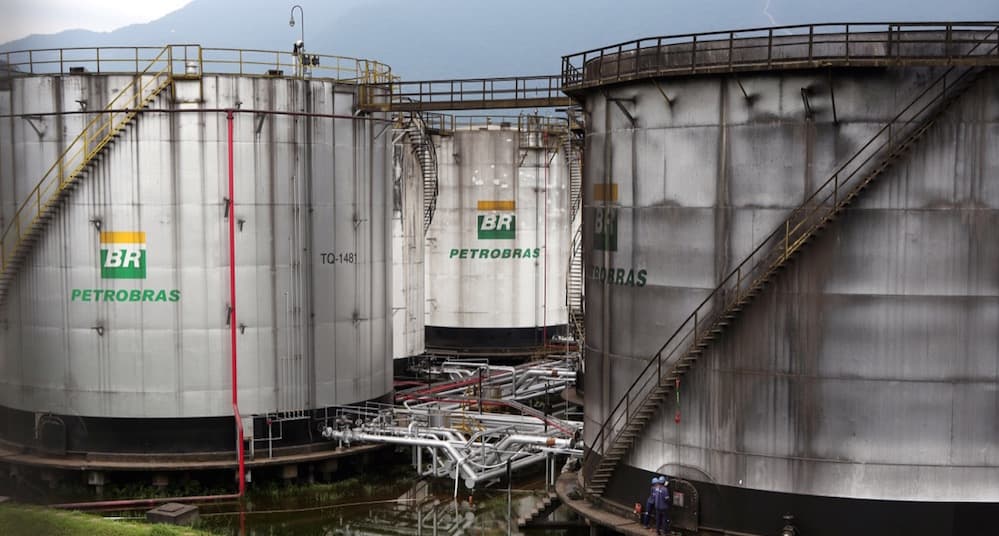 Workers repair a tank of Petrobras oil company in Cubatao, Brazil, on April 12.
