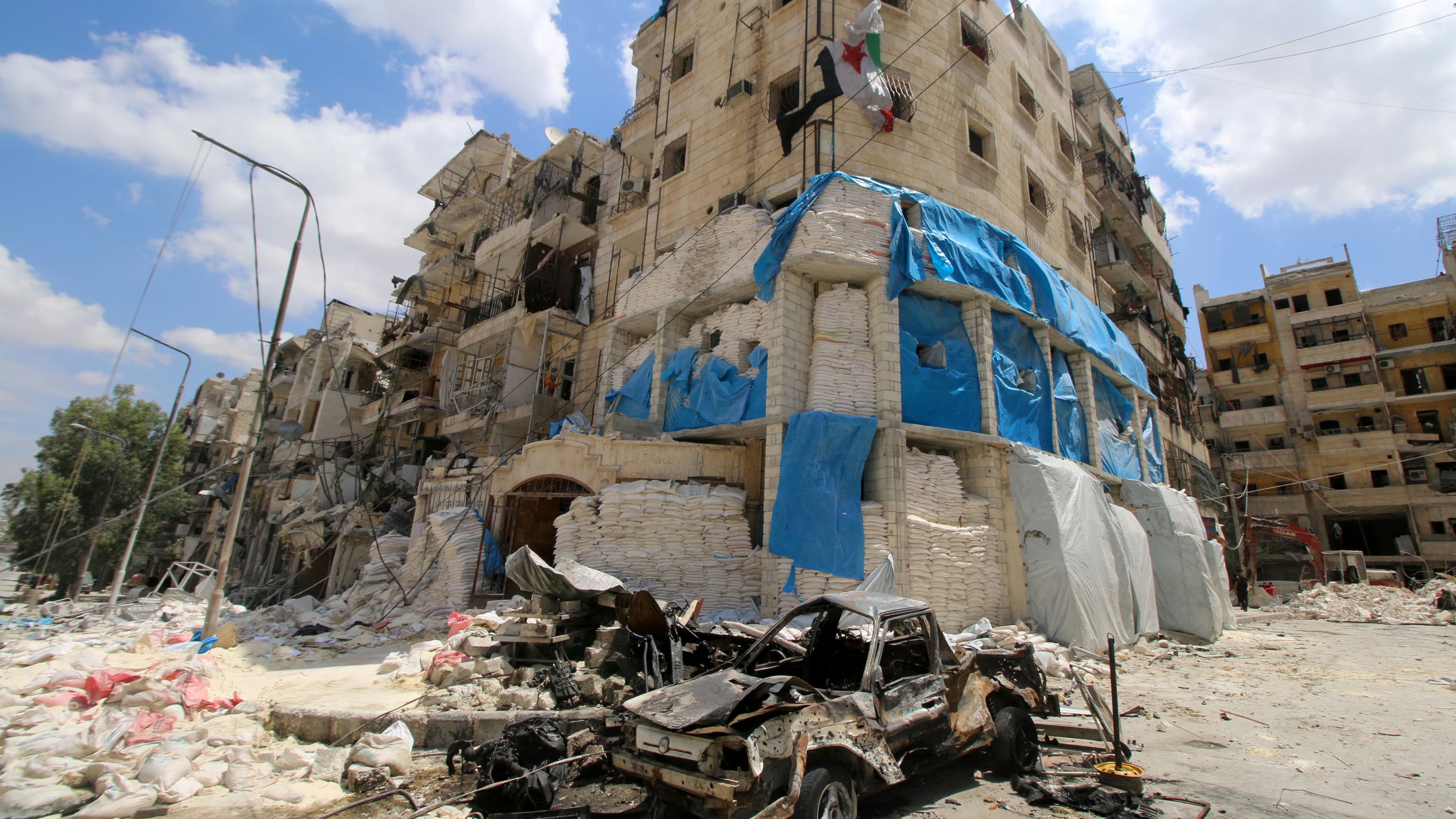 Burnt vehicles in front of a hospital hit by airstrikes, in a rebel-held area of Aleppo.